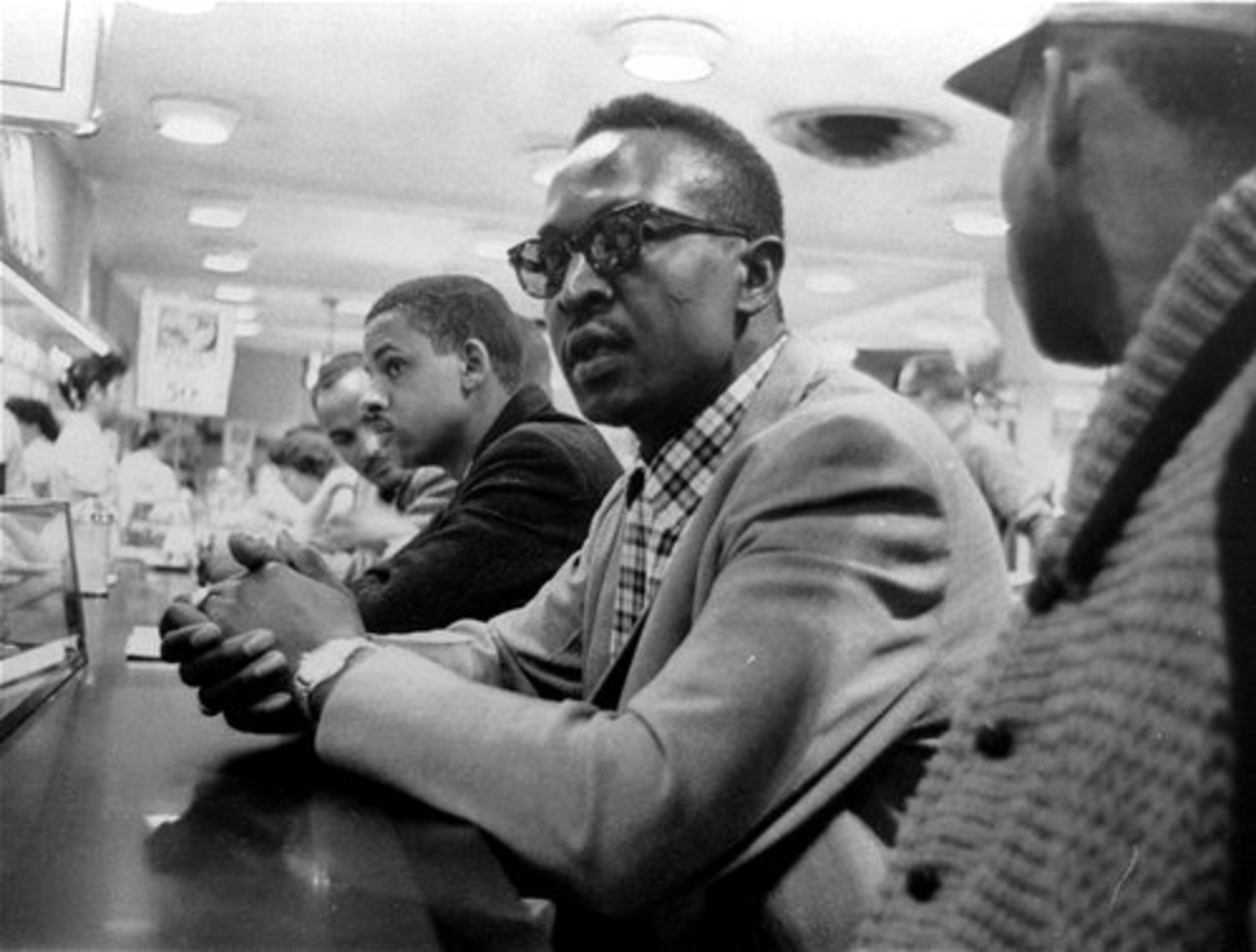 Black students wait in vain for food service at this F.W. Woolworth store in Greensboro, N.C., in this April 20, 1960 photo. The Woolworth's lunch counter that became a symbol of the nation's civil rights movement in 1960 is part of an exhibit of national icons at the Smithsonian's National Museum of American History.