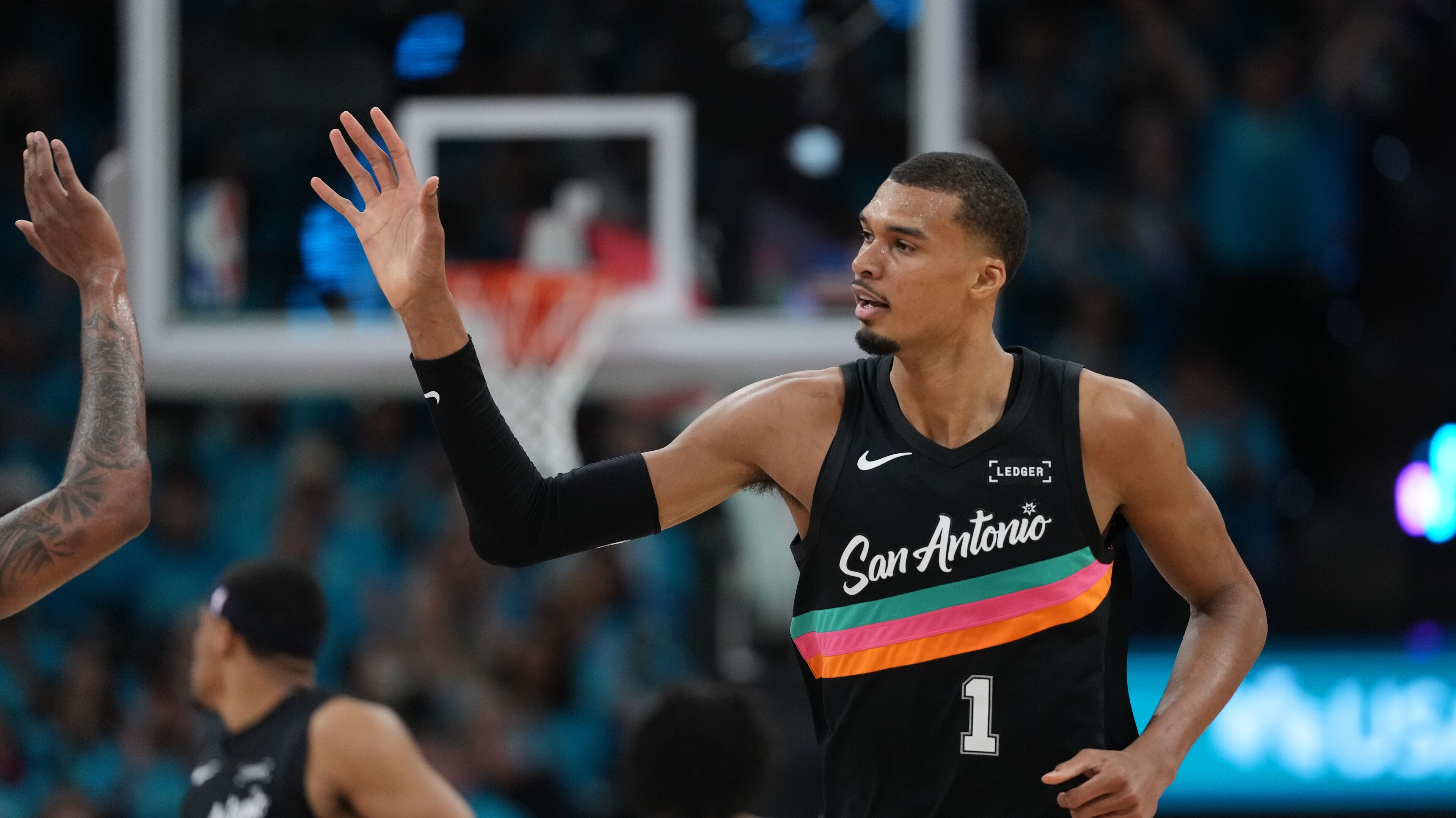 San Antonio Spurs forward Victor Wembanyama (1) celebrates a play against the Portland Trail Blazers during the first half in Game 1 of a first-round NBA playoffs basketball series in San Antonio, Sunday, April 19, 2026. (AP Photo/Eric Gay)