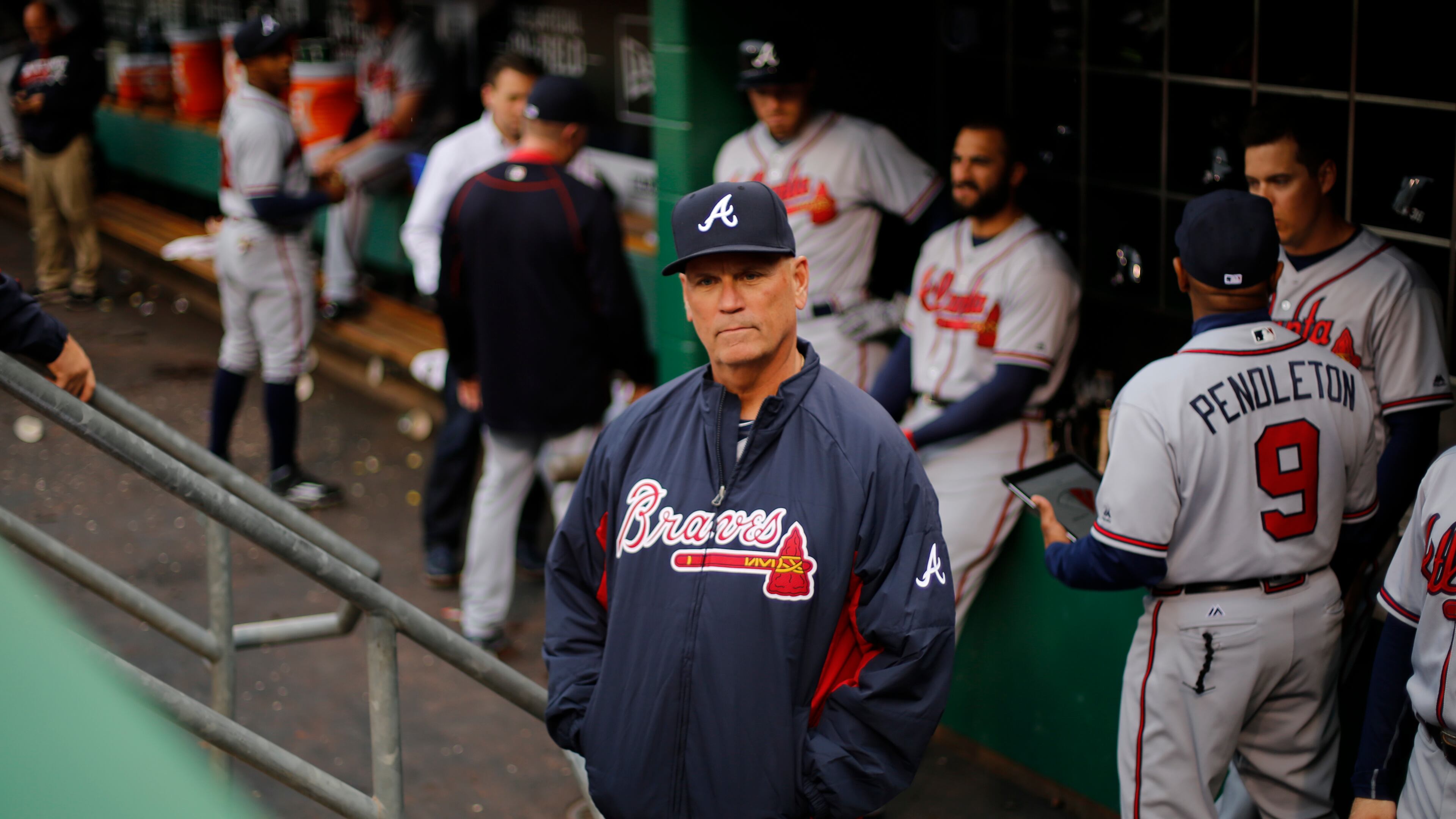 Atlanta Braves interim manager Brian Snitker stands in the dugout before a baseball game against the Pittsburgh Pirates in Pittsburgh, Tuesday, May 17, 2016. (AP Photo/Gene J. Puskar)