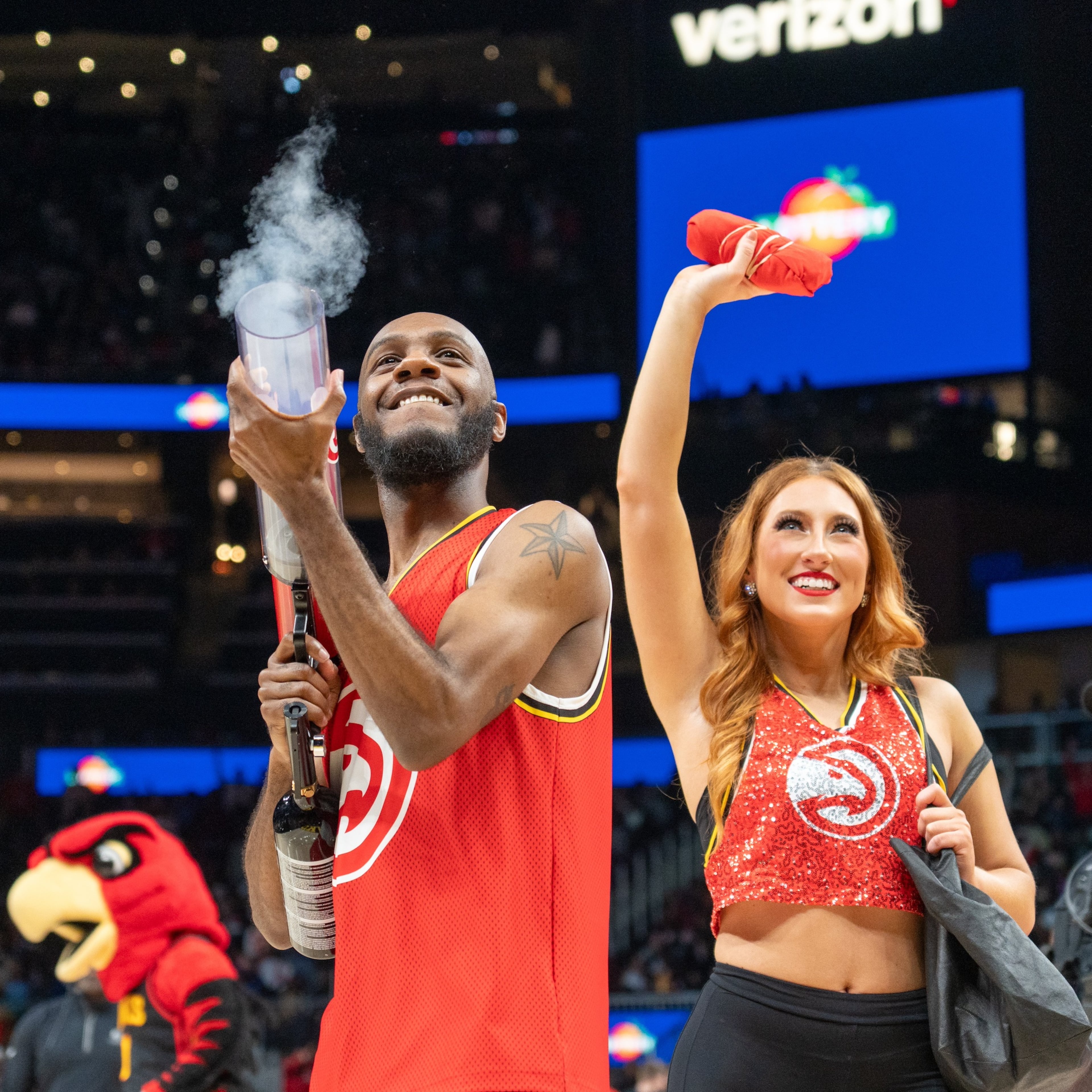 Calvin Brown put some muscle into launching fan freebies with the T-shirt cannon. (Courtesy of Atlanta Hawks)