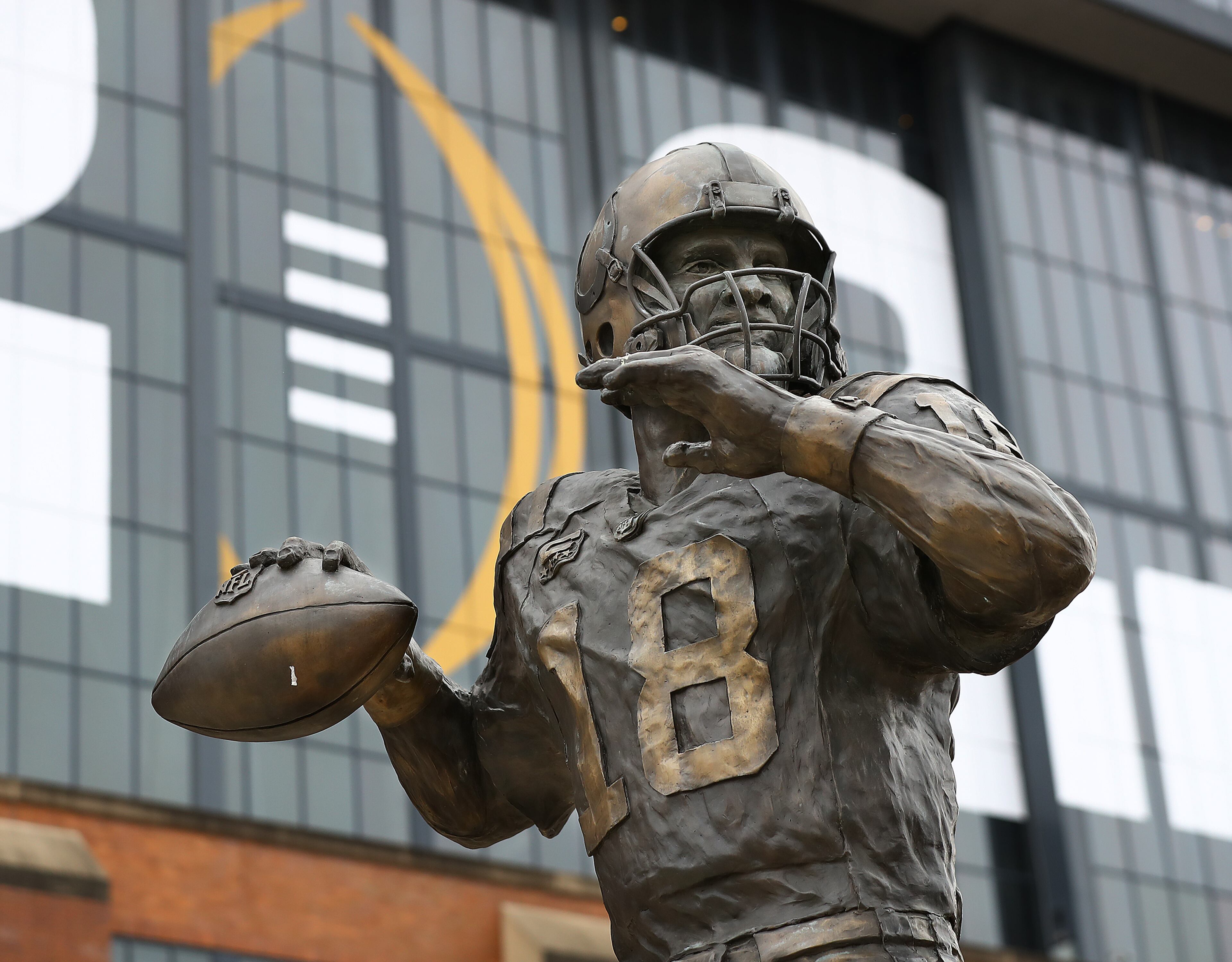 010622 Indianapolis: A bronze statue of "The Sheriff" Peyton Manning, the Indianapolis Colts quarterback 1998-2011, is seen outside Lucas Oil Stadium on Thursday, Jan. 6, 2022, where Georgia will play Alabama for the national championship in Indianapolis. “Curtis Compton / Curtis.Compton@ajc.com”`