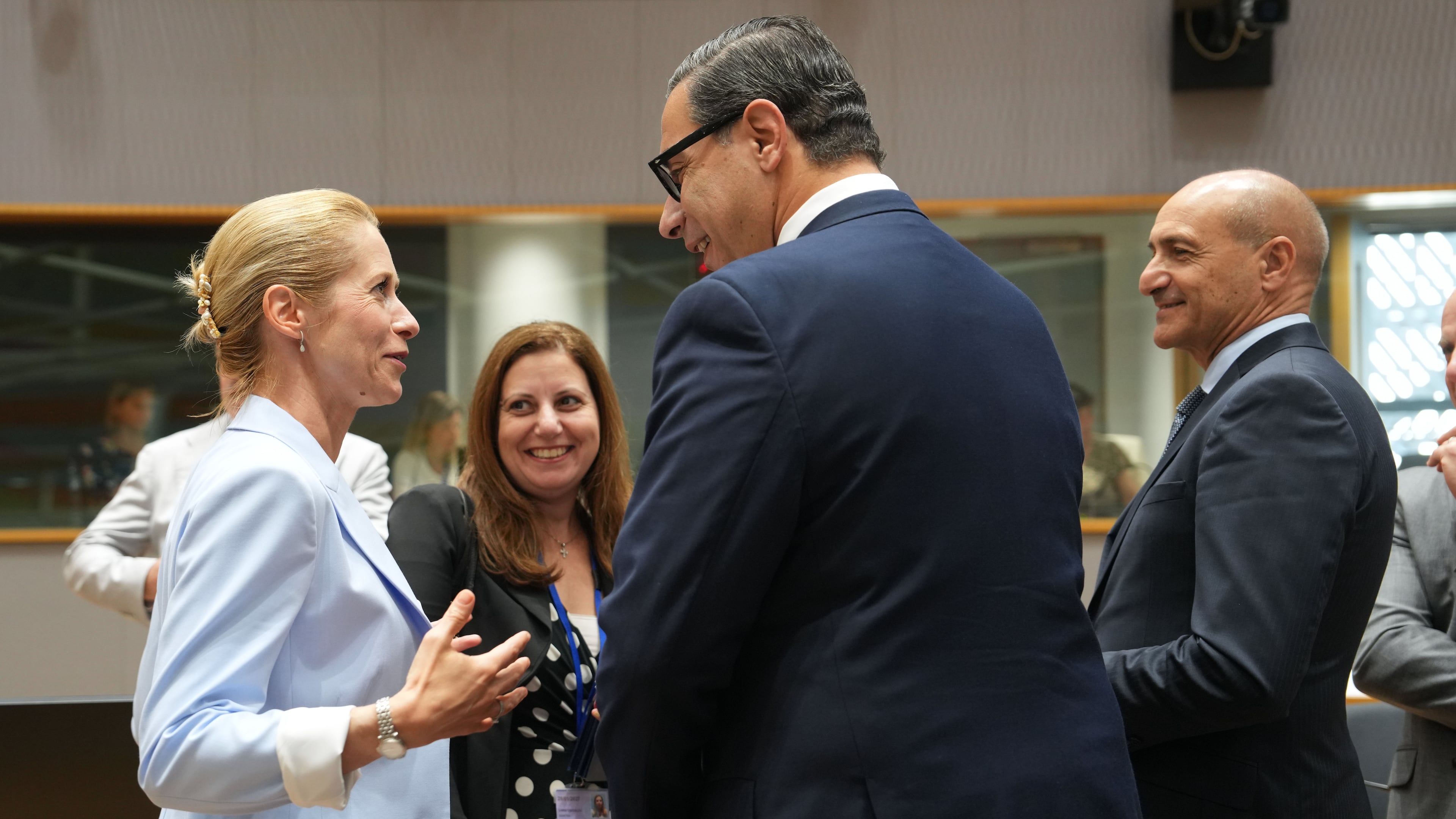 European Union foreign policy chief Kaja Kallas, left, speaks with Cypriot Foreign Minister Constantinos Kombos, center, during a round table meeting of EU foreign ministers in Brussels, Monday, July 13, 2026. (AP Photo/Marius Burgelman)