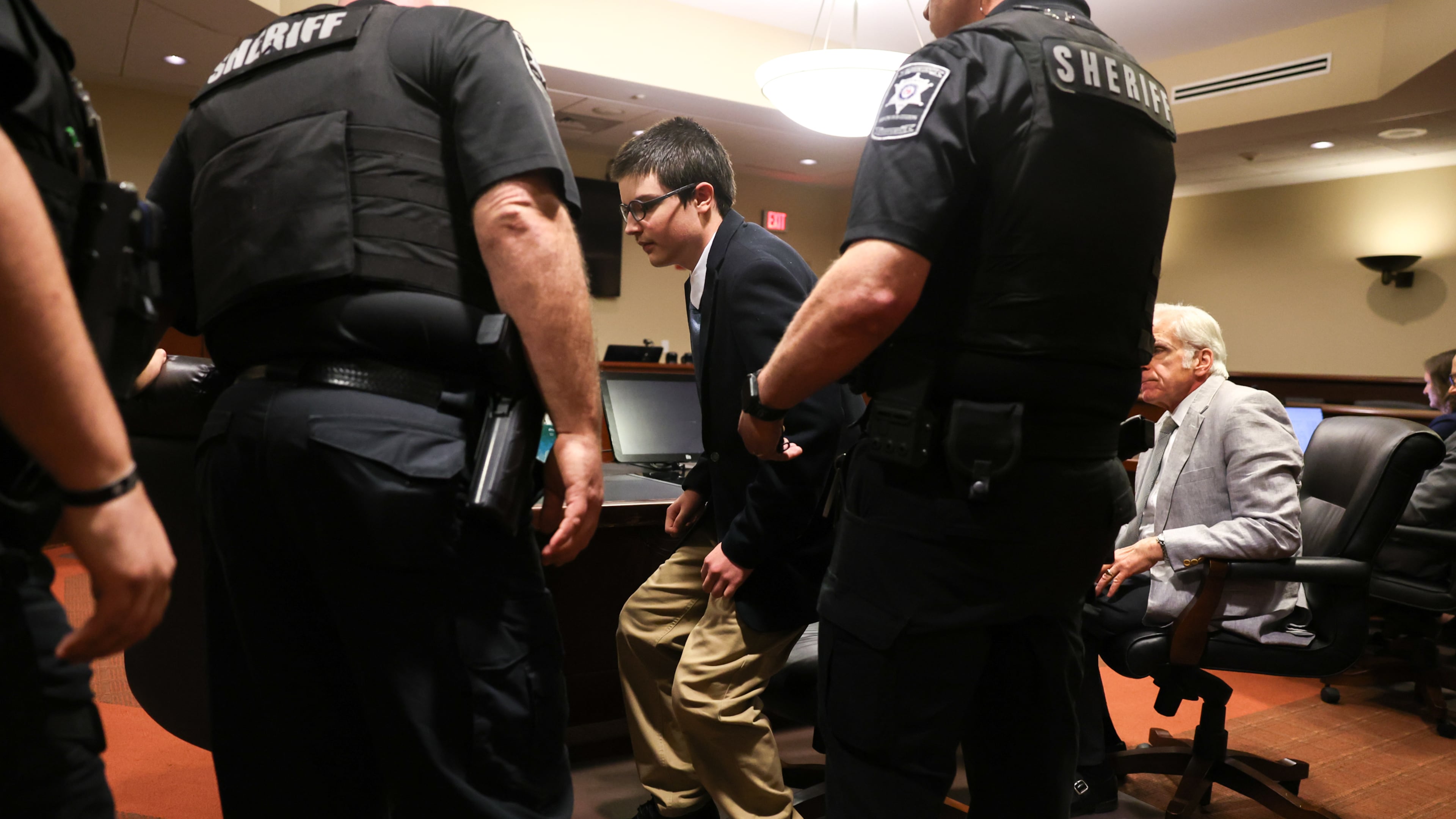 Colt Gray, the 16-year-old Apalachee High School shooter, stands to be handcuffed following his sentencing at Barrow County Superior Court in Winder on July 28, 2026. He received life without parole. (Arvin Temkar/AJC)