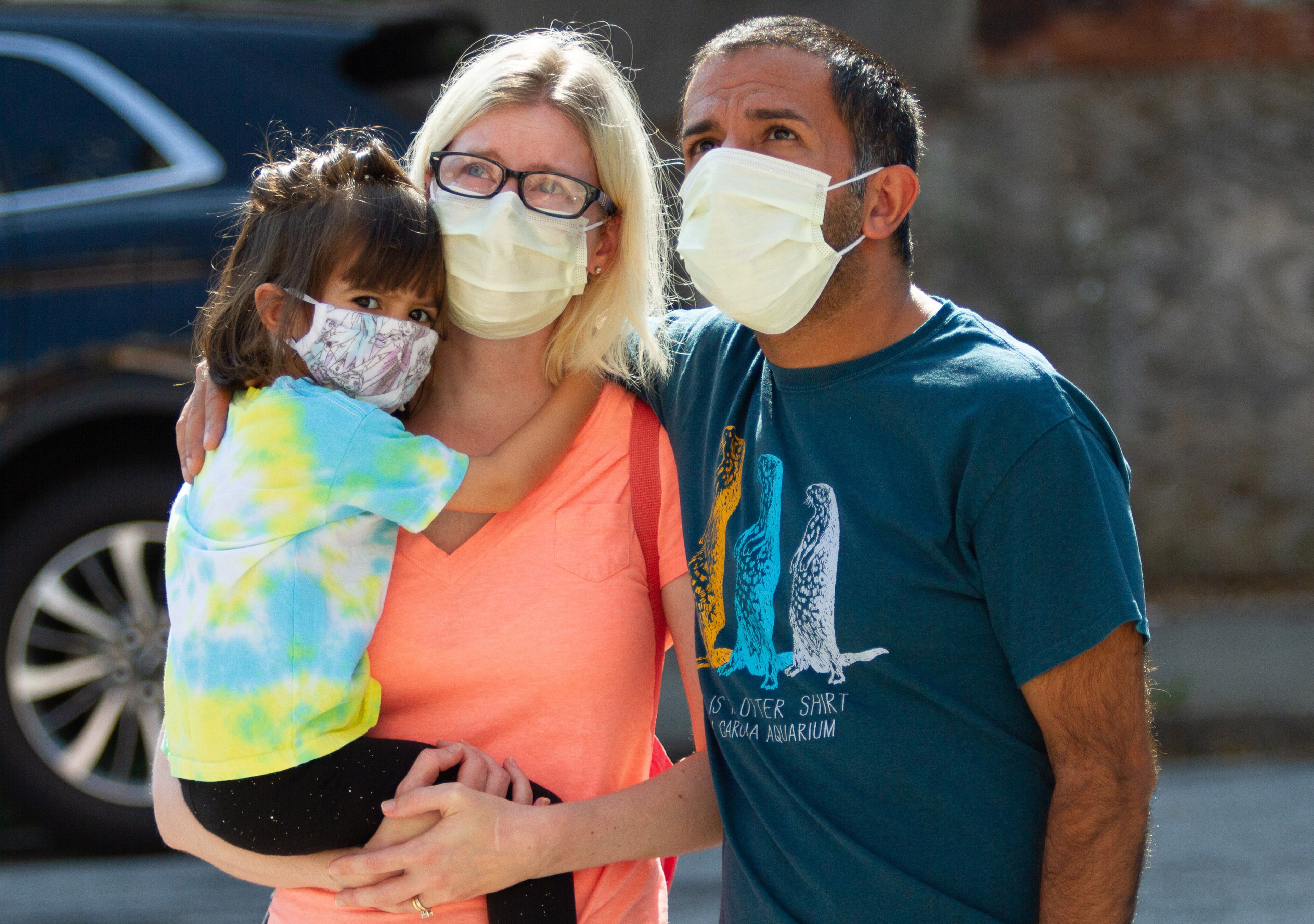 Akshat and Judith Pujara, along with their daughter Alice look over the large John Lewis mural on Auburn Ave, July 18, 2020. STEVE SCHAEFER FOR THE ATLANTA JOURNAL-CONSTITUTION