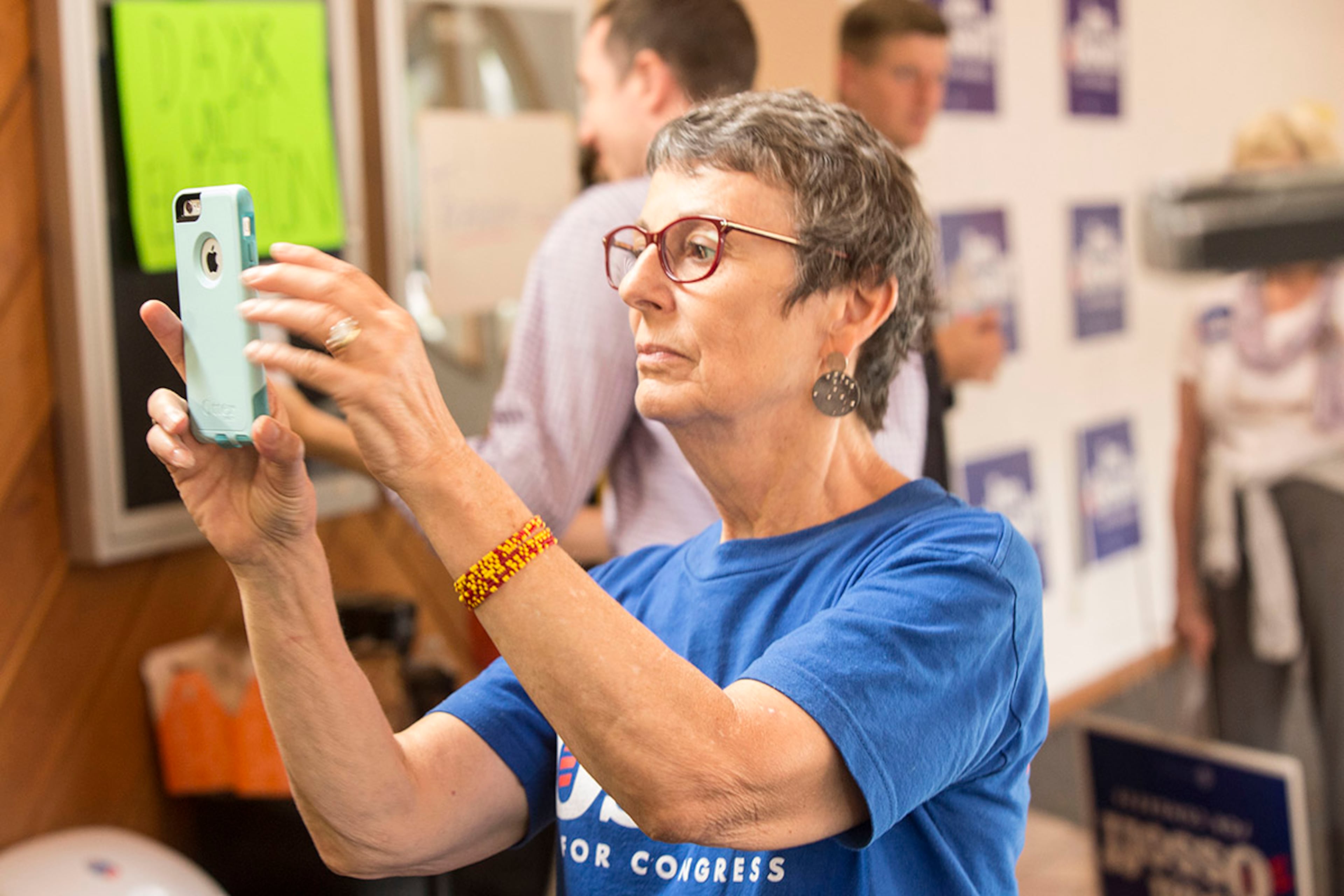 Ellen Fenoglio takes a picture of Jon Ossoff as he talks to members of the press at the Sandy Springs Canvass Launch. Voters head to the polls on June 20, 2017 to vote in the run-off. It has shaped up as the most expensive House contest in the nation's history, pitting Karen Handel against Jon Ossoff for Tom Price's former seat.