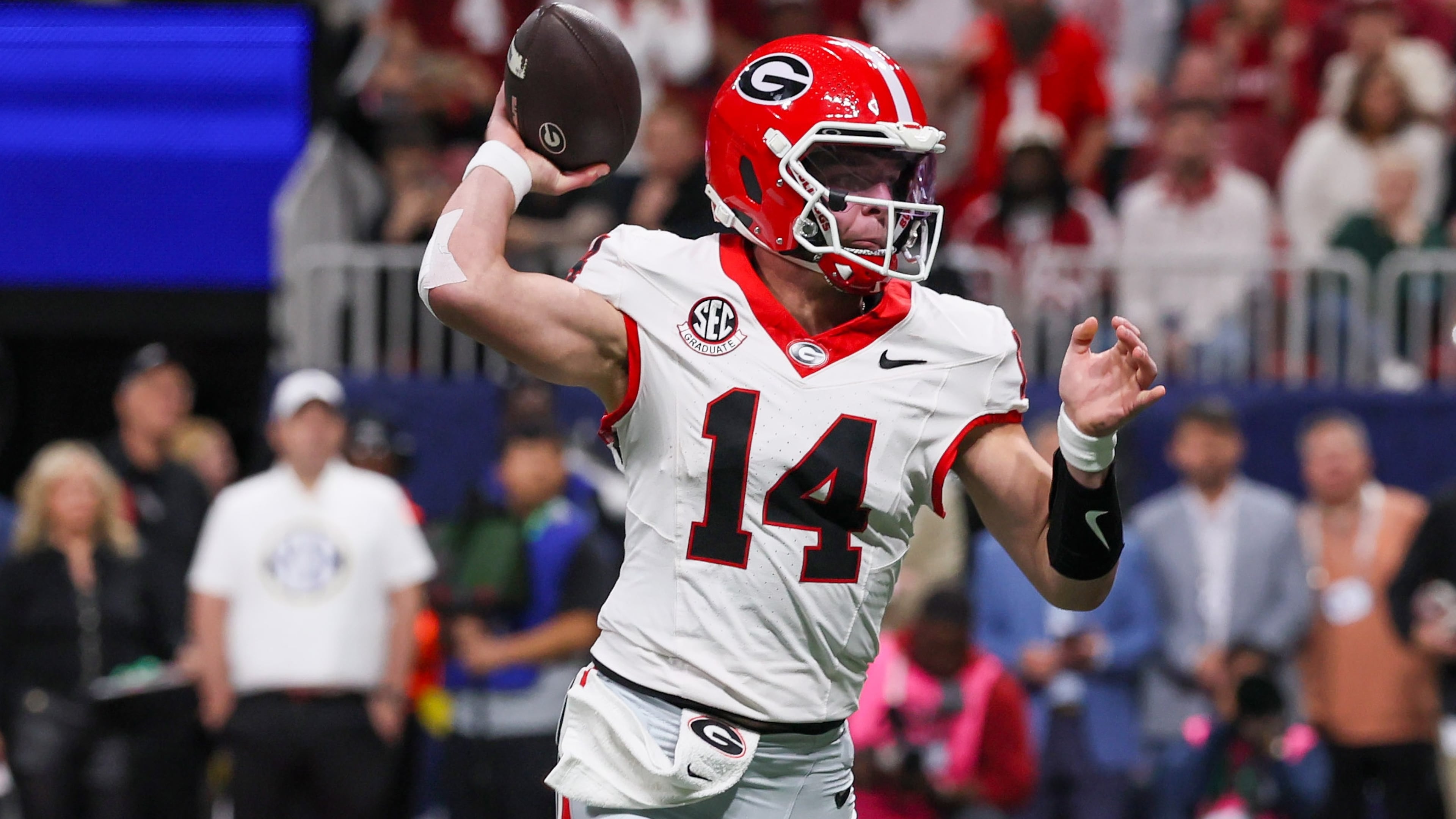 Georgia quarterback Gunner Stockton throws his first touchdown to Roderick Robinson II (not pictured) against Alabama during the first quarter of the SEC Championship game at Mercedes-Benz Stadium, Saturday, Dec. 6, 2025, in Atlanta. (Jason Getz/AJC)