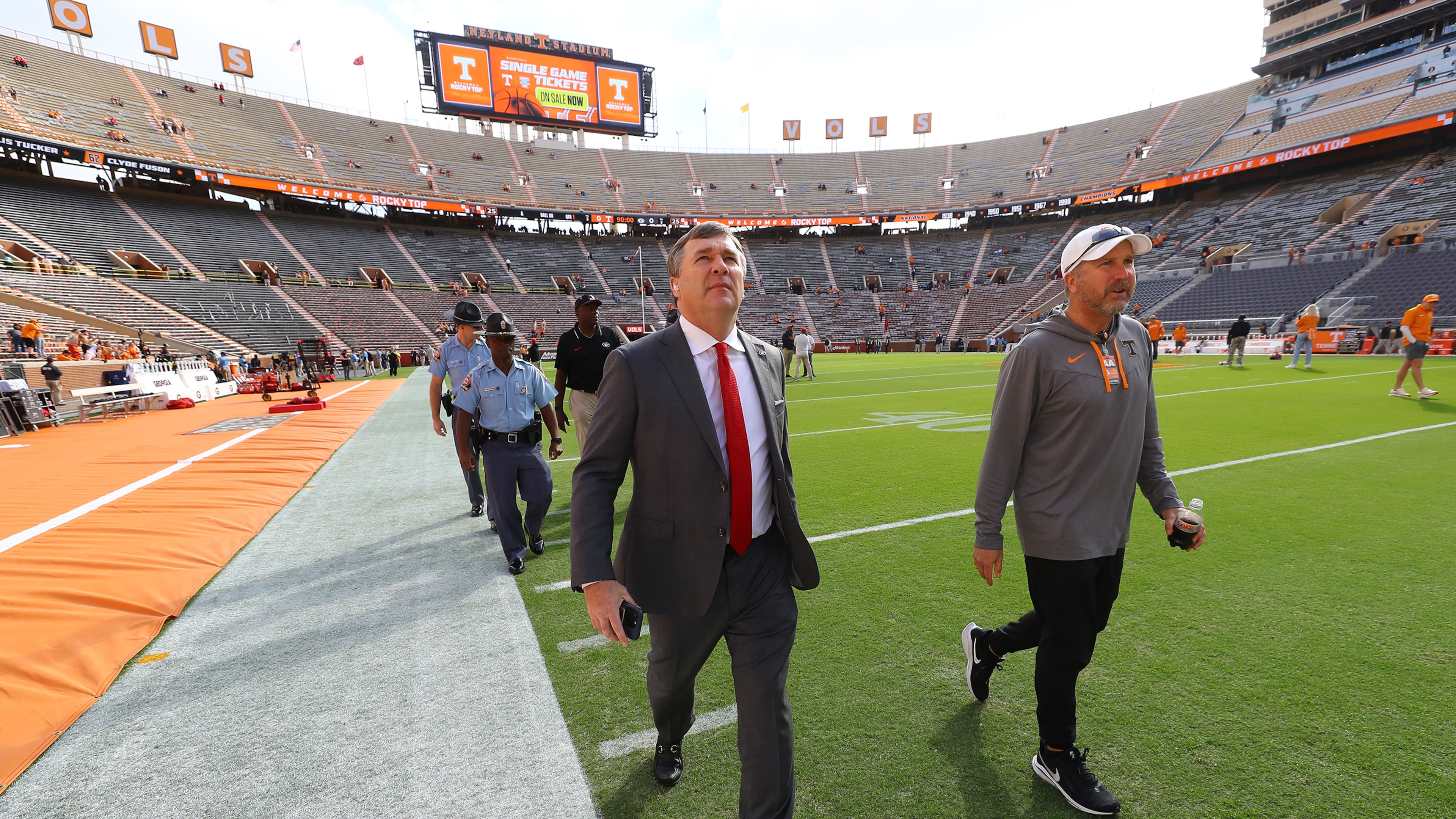 Georgia head coach Kirby Smart takes a walk around the field at Neyland Stadium as his team arrives to play Tennessee in a NCAA college football game in Knoxville. Tennessee Sports Technology Coordinator Don Rawson walks beside Smart after greeting him. (Curtis Compton for the AJC 2023)