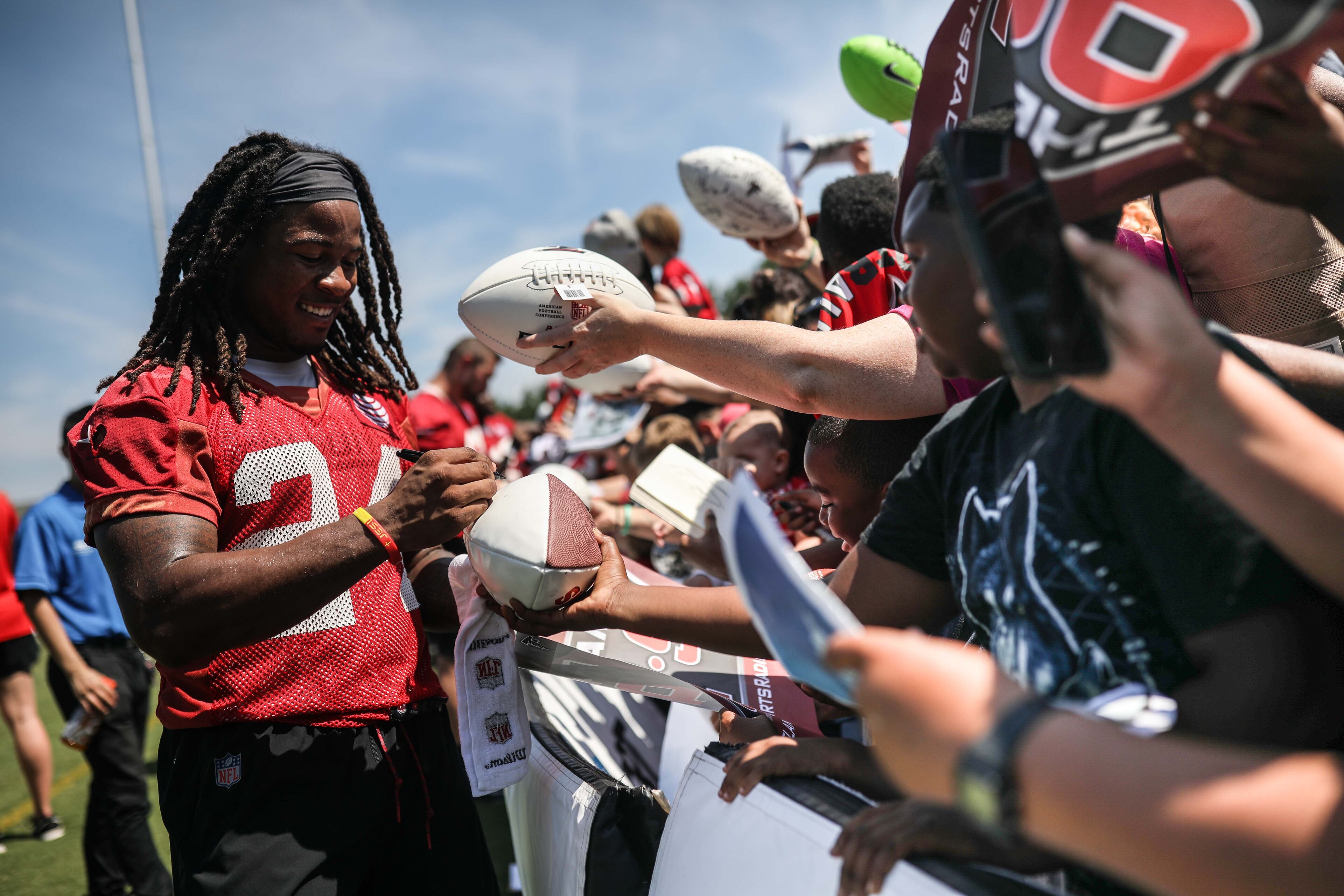 Running back Devonta Freeman signs autographs during training camp, Saturday, July 28, 2018, in Flowery Branch, Ga. BRANDEN CAMP/SPECIAL