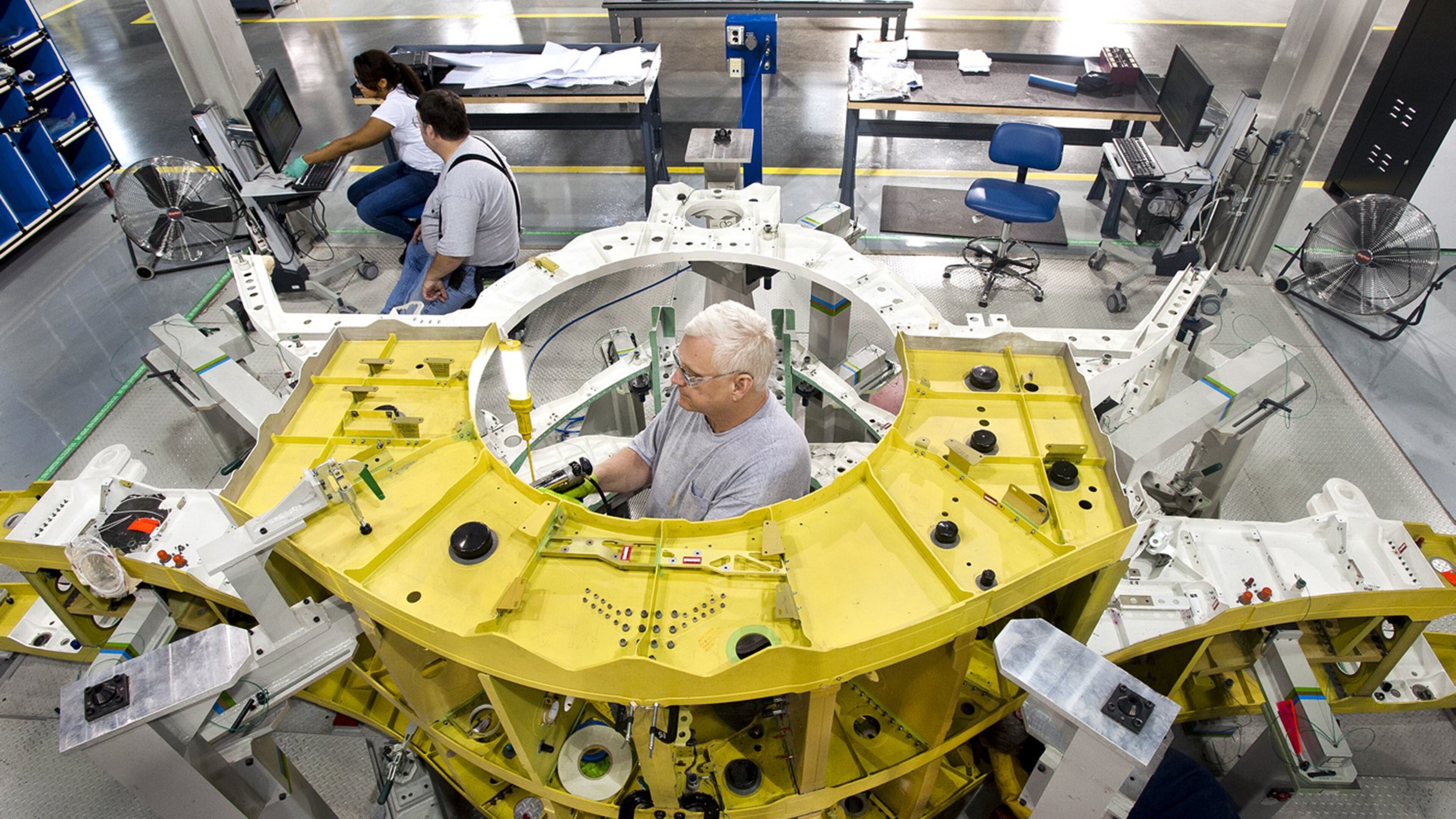 Lockheed Martin mechanics assemble components of an F-35 Joint Strike Fighter’s center wing in Marietta. (Photo by John Rossino, Lockheed Martin Aeronautics Co.)