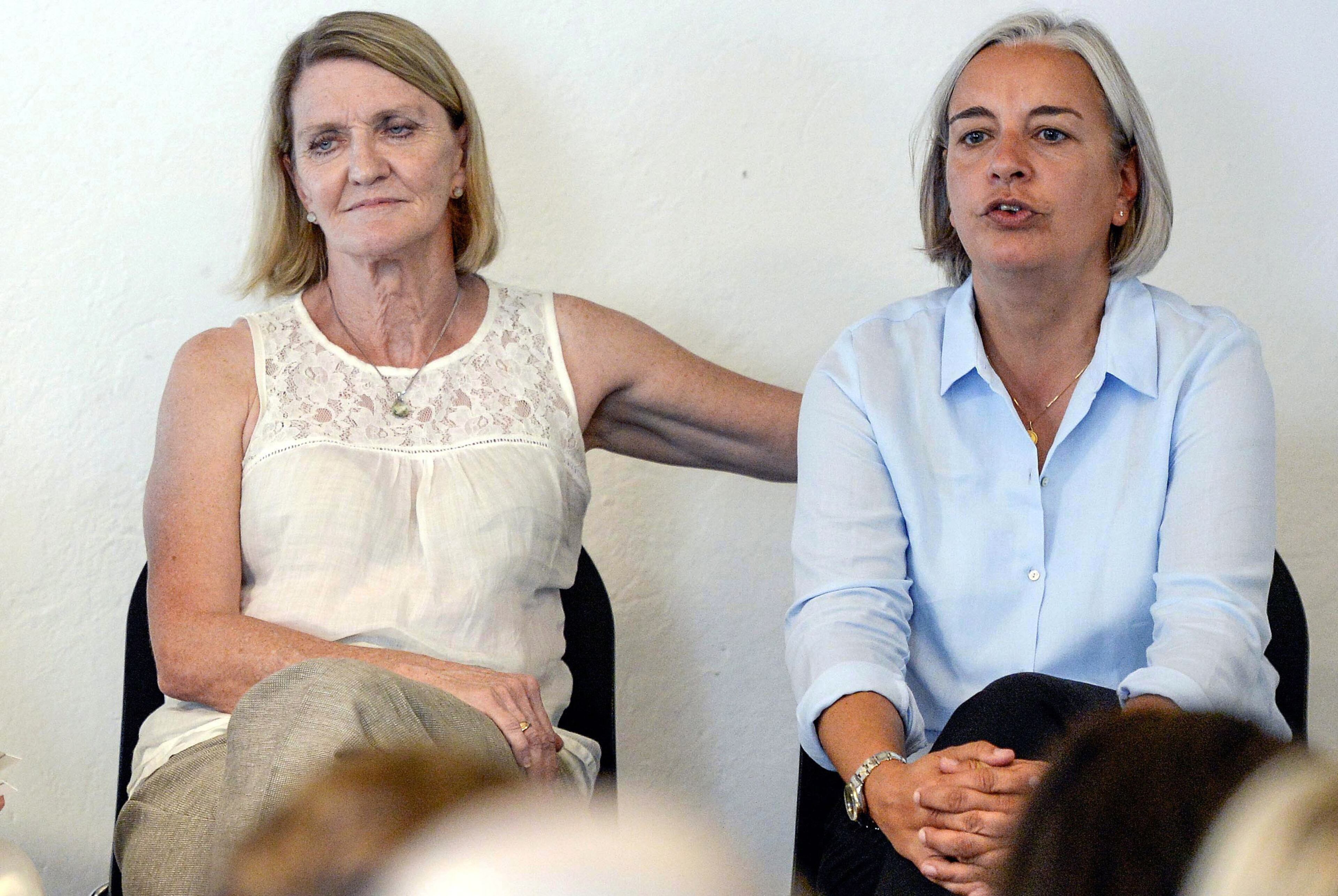 In this Aug. 27, 2013 file photo Associated Press photographer Anja Niedringhaus, right, and AP journalist Kathy Gannon, are pictured during a visit to the photo agency Keystone in Zurich, Switzerland . Niedringhaus, 48, was killed and Kathy Gannon was wounded Friday, April 4, 2014 when an Afghan policeman opened fire while they were sitting in their car in eastern Afghanistan. Niedringhaus, an internationally acclaimed German photographer, was killed instantly, according to an AP freelancer who witnessed the shooting. Gannon, the reporter, was wounded twice and is receiving medical attention. (AP Photo/Keystone, Walter Bieri, File)