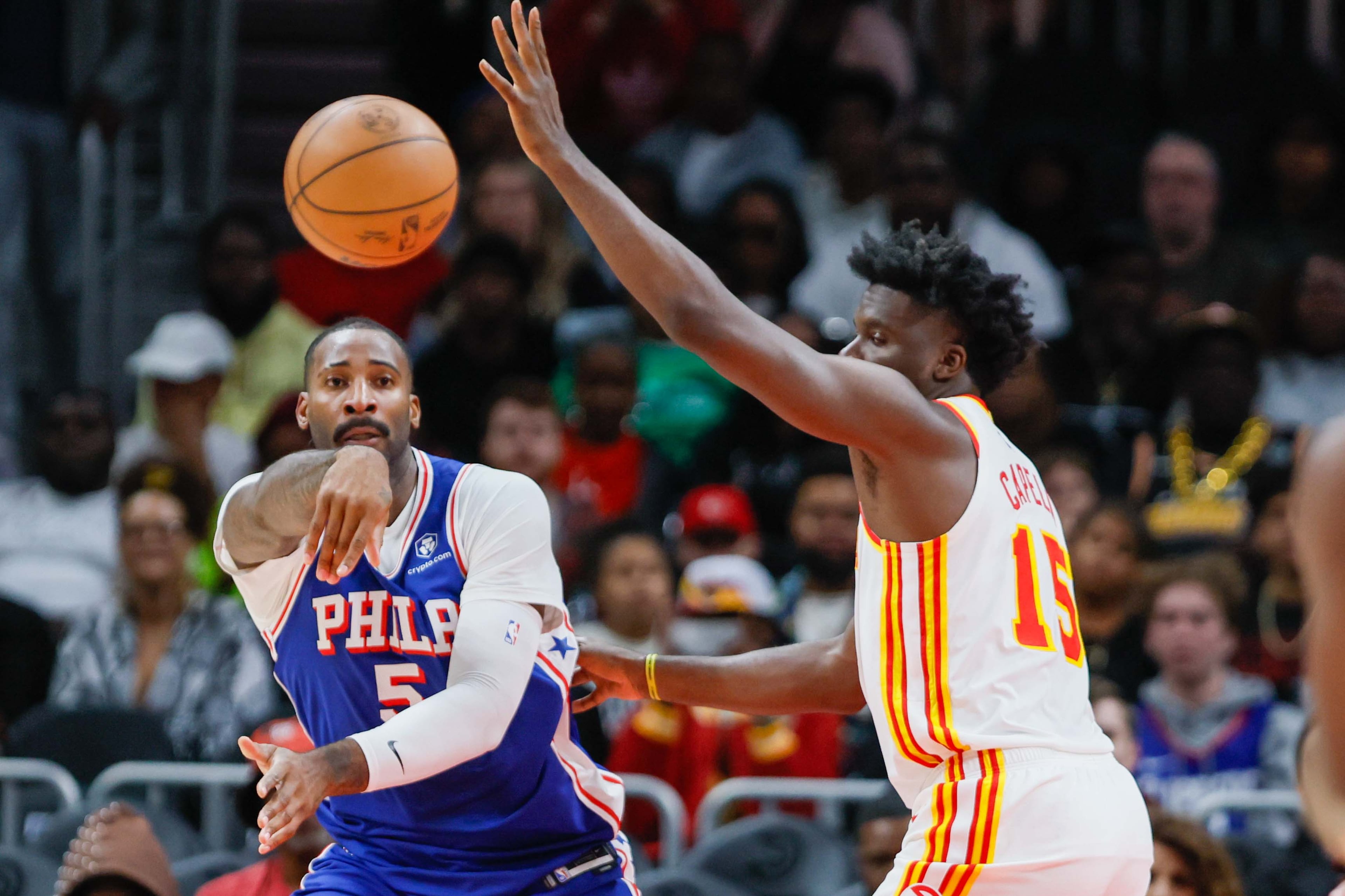 Philadelphia 76ers center Andre Drummond (5) attempts a pass under pressure from Atlanta Hawks center Clint during the second half at State Farm Arena during an NBA exhibition game on Monday, October 14, 2024, in Atlanta.Capela (15)
(Miguel Martinez/ AJC)