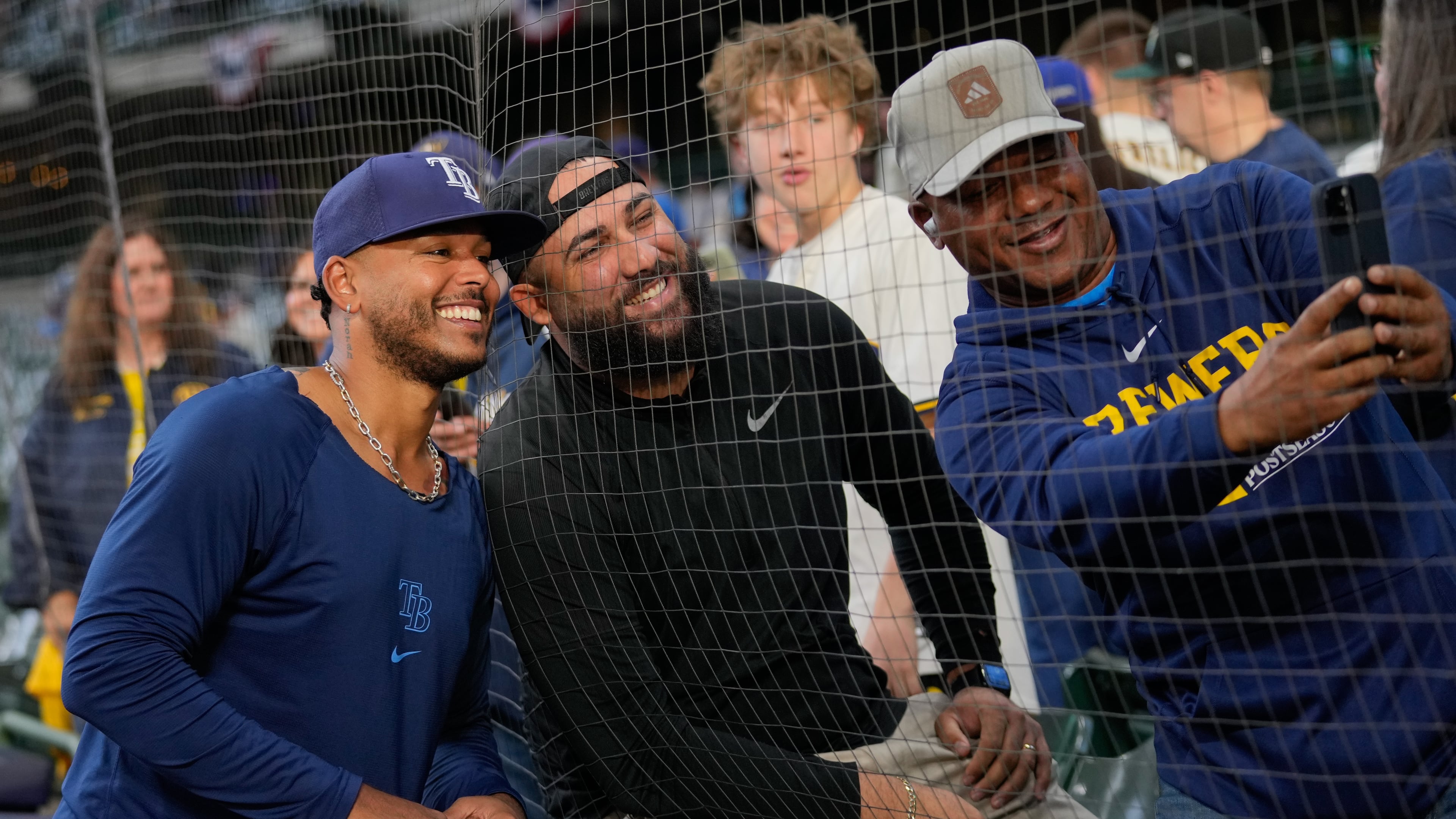 Tampa Bay Rays pitcher Freddy Peralta takes a photo with fans prior to Game 2 of baseball's World Series, Saturday, Oct. 24, 2026, in Milwaukee, between the Milwaukee Brewers and the Tampa Bay Rays. (AP Photo/Kayla Wolf)