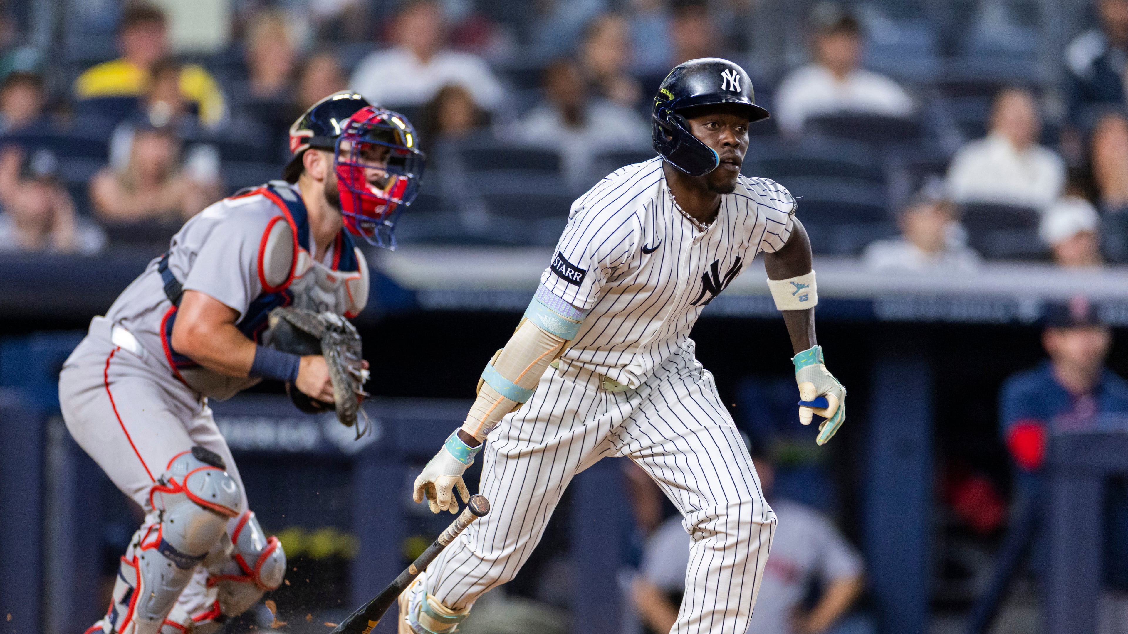 New York Yankees' Jazz Chisholm Jr., right, watches after he hit into a fielder's choice in the eighth inning during the second baseball game of a doubleheader against the Boston Red Sox, Saturday, Aug. 29, 2026, in New York. (AP Photo/Corey Sipkin)