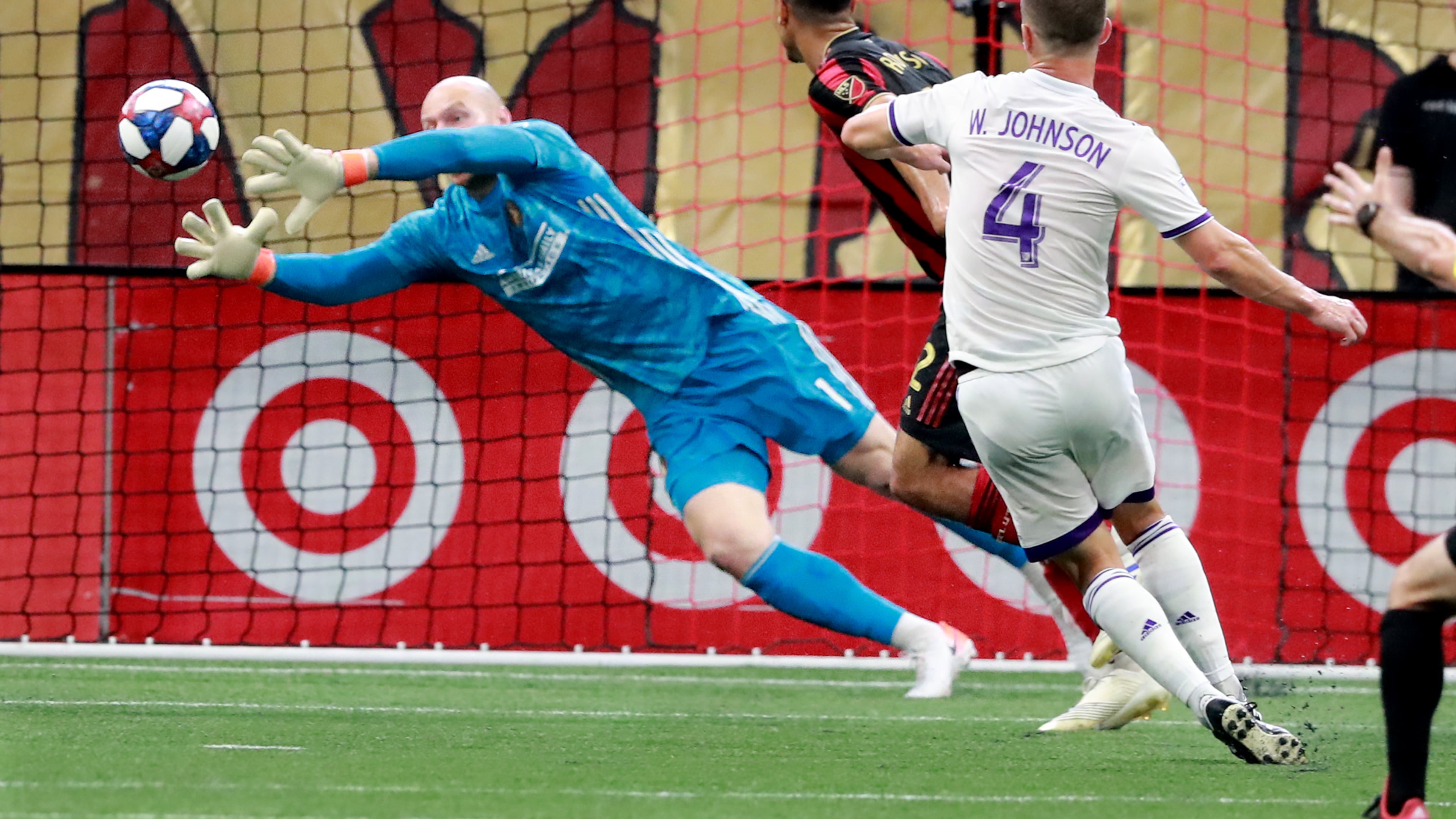 May 12, 2019 Atlanta: Atlanta United goalkeeper Brad Guzan blocks a shot by Orlando City defender Will Johnson during the first half of a MLS soccer match on Sunday, May 12, 2019, in Atlanta. Atlanta United won the game 1-0. Curtis Compton/ccompton@ajc.com
