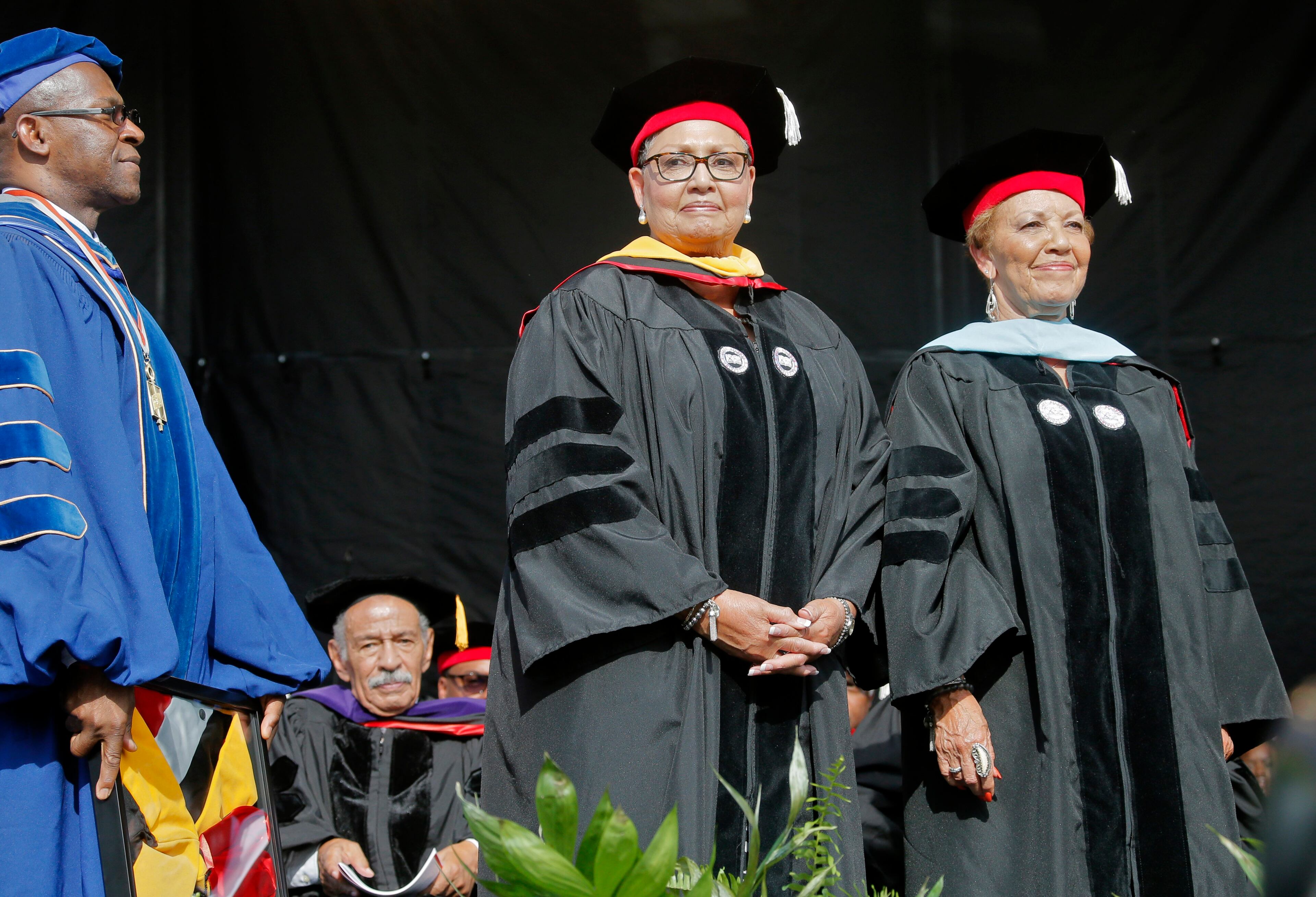 5/22/17 - Atlanta - Katherine Moore (left) and Joylette Hylick accept an honorary degree on behalf of their mother, "Hidden Figures" Katherine Coleman Goble Johnson. Clark Atlanta University's Panther Stadium was the site of their 28th annual Commencement. Businessman William Pickard gave the commencement address. Rev. Jesse Jackson, who received an honorary degree, also spoke. Panther Stadium, BOB ANDRES /BANDRES@AJC.COM