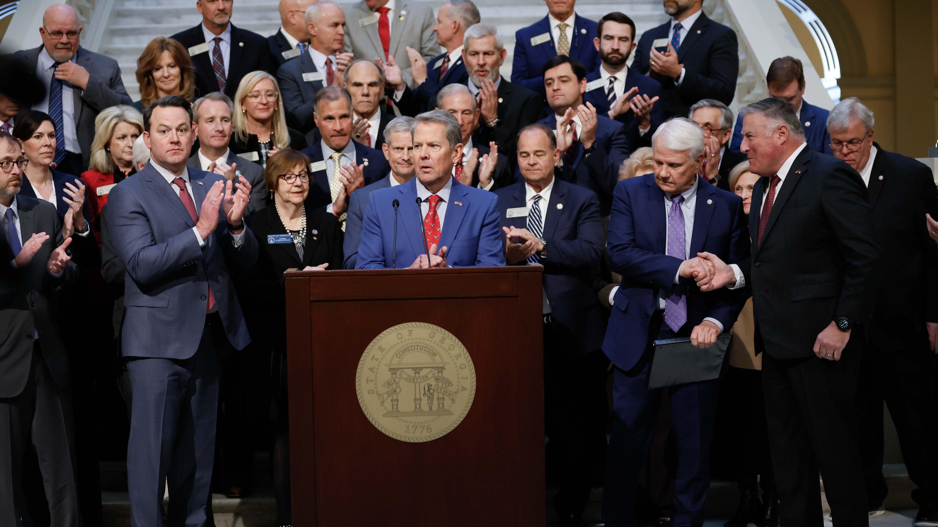 Lt. Gov. Burt Jones (from left), Gov. Brian Kemp, Speaker of the House Jon Burns and Insurance Commissioner John King applaud during a news conference related to Medicaid on Wednesday, Jan. 15, 2025, at the state Capitol in Atlanta. (Miguel Martinez/AJC)
