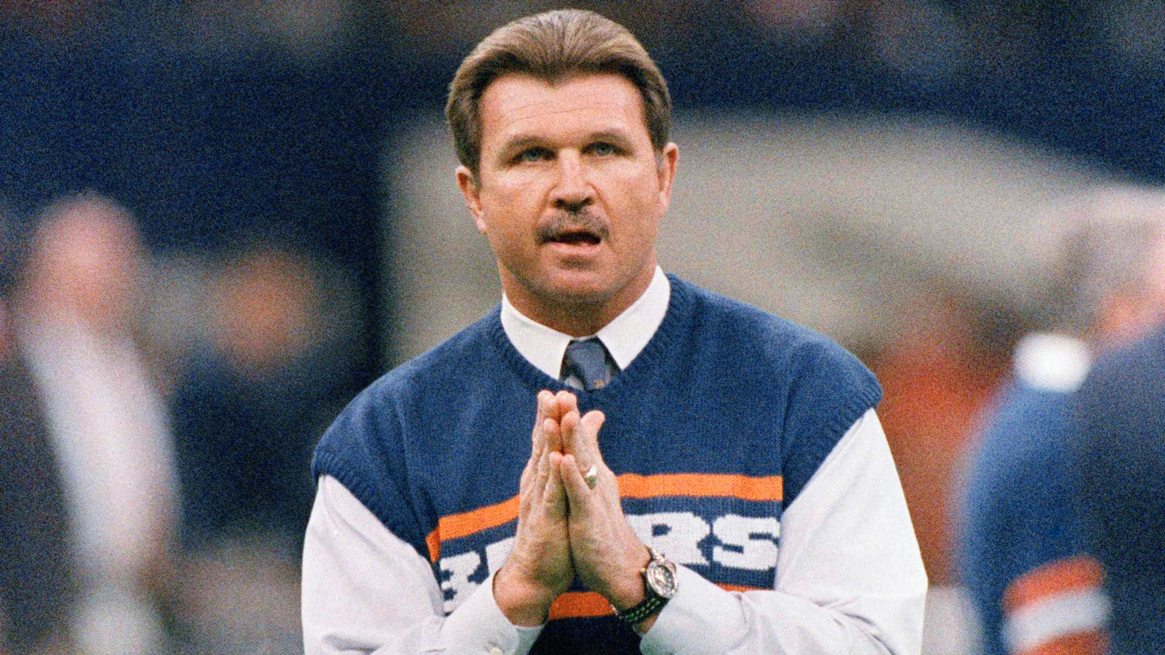 FILE - Chicago Bears head coach Mike Ditka strikes a prayerful pose as he watches the team workout, Jan. 26, 1986 in New Orleans before the start of NFL football's Super Bowl XX. (AP Photo/Rob Kozloff, File)