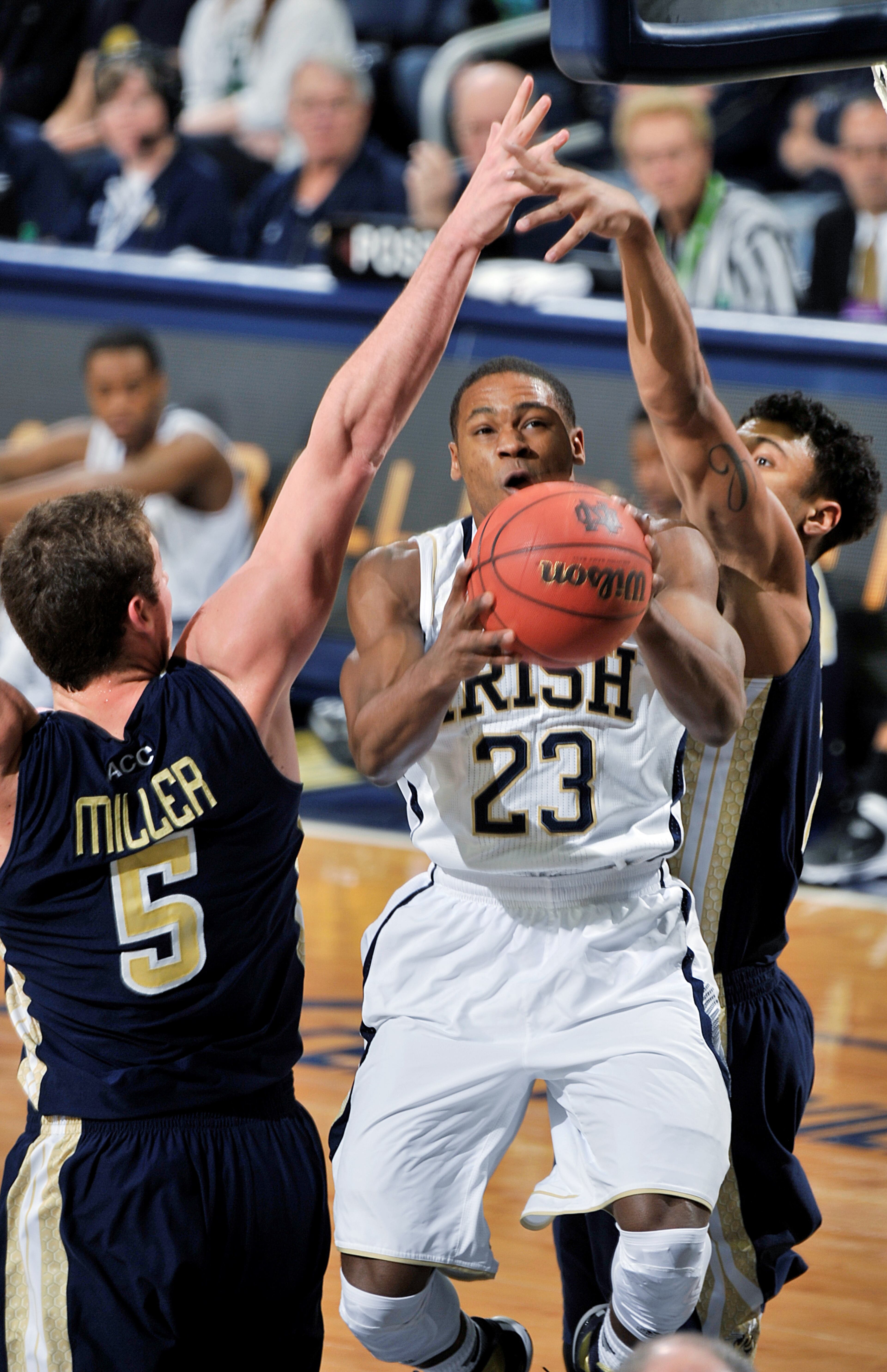 Notre Dame guard Demetrius Jackson drives the lane as Georgia Tech center Daniel Miller, left, and guard Chris Bolden defend during the first half of an NCAA college basketball game, Wednesday, Feb. 26, 2014 in South Bend, Ind. (AP Photo/Joe Raymond)