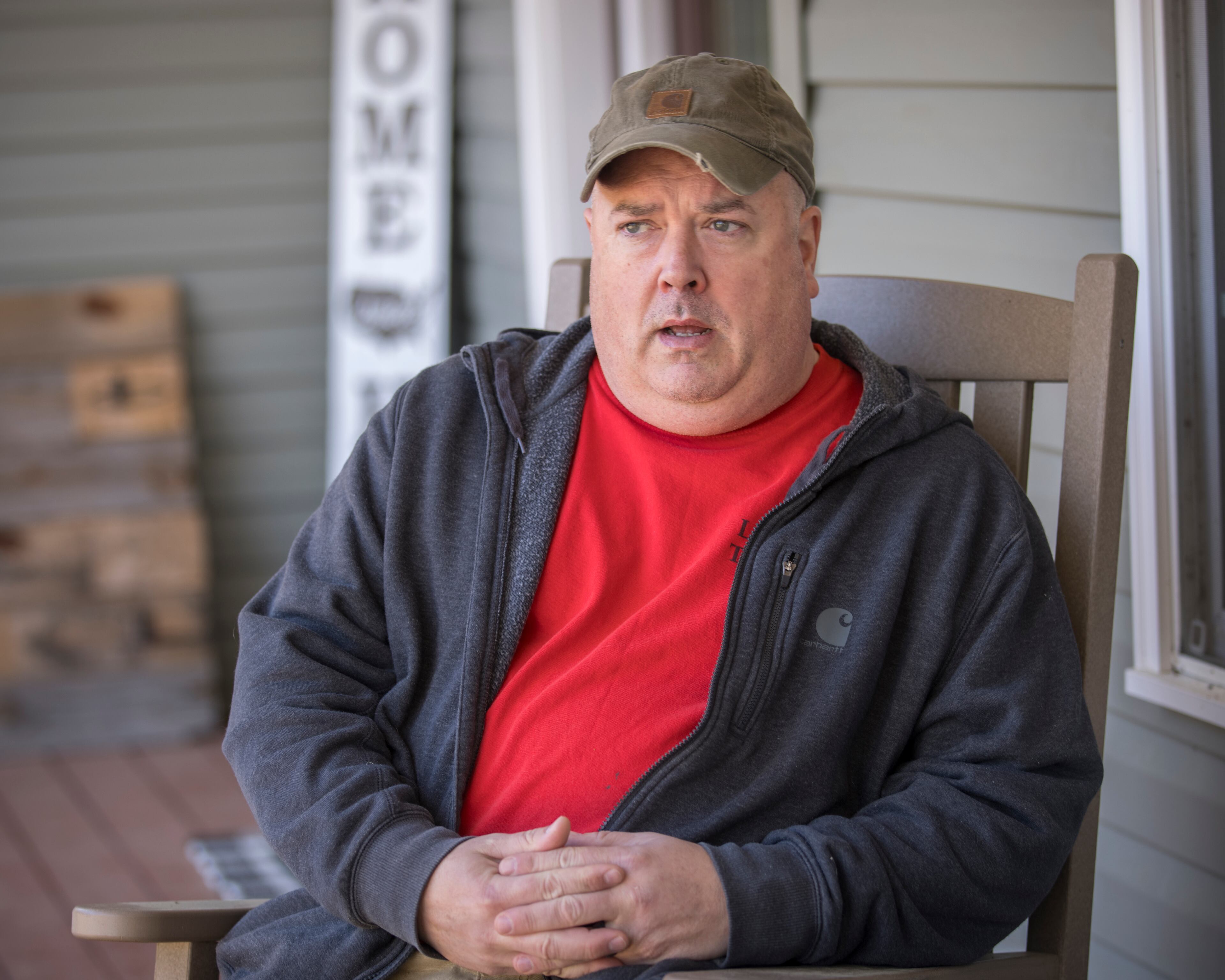 David Bennett, an Army veteran and flight nurse, speaks on his front porch on Wednesday, Feb. 21, 2024 near Brooklet, Ga. Bennett opposes the proposed wells and worries how industrial growth in the region will change his community. (AJC Photo/Stephen B. Morton)