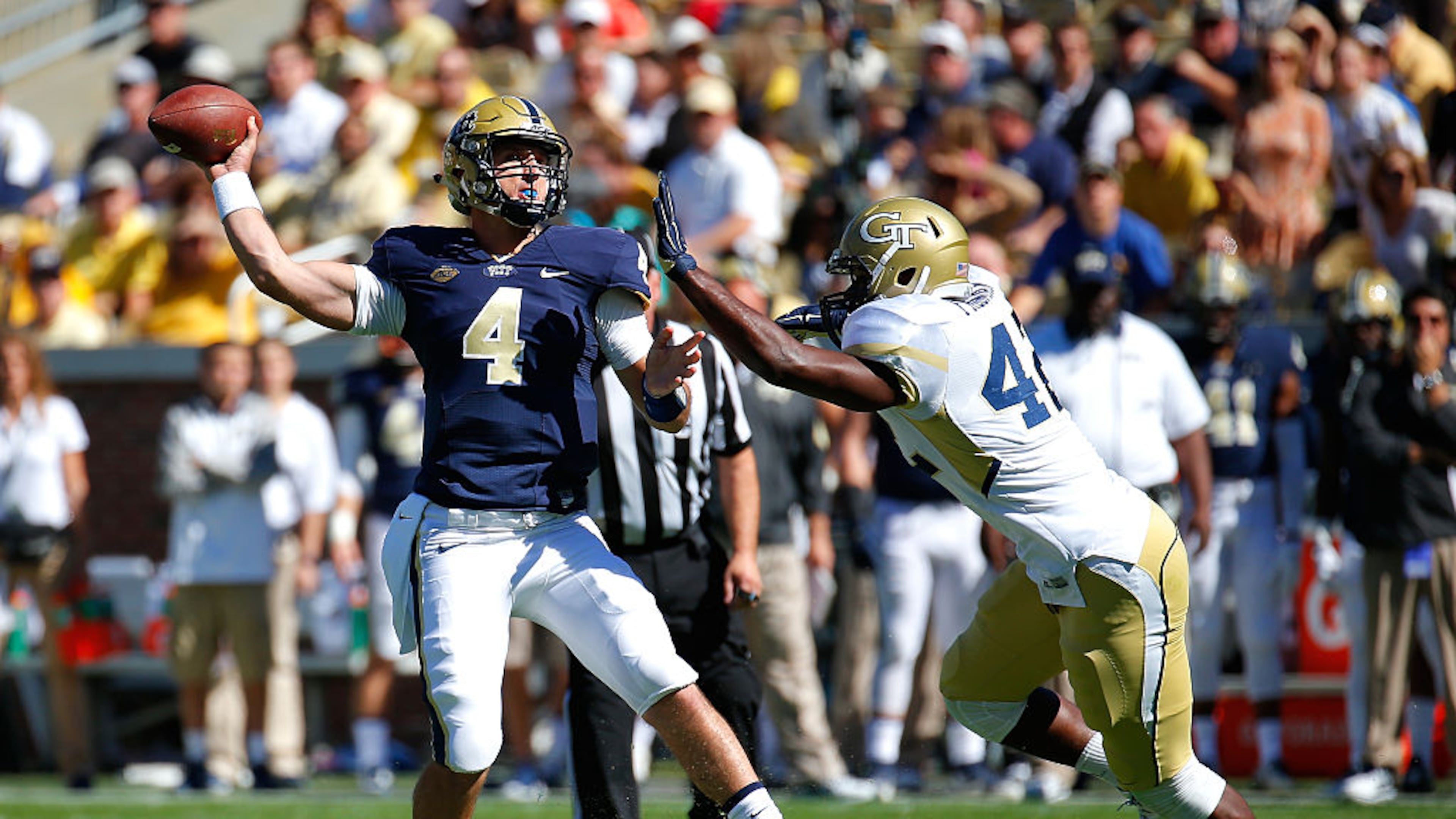 ATLANTA, GA - OCTOBER 17: Nathan Peterman #4 of the Pittsburgh Panthers is pressured by KeShun Freeman #42 of the Georgia Tech Yellow Jackets at Bobby Dodd Stadium on October 17, 2015 in Atlanta, Georgia. (Photo by Kevin C. Cox/Getty Images)