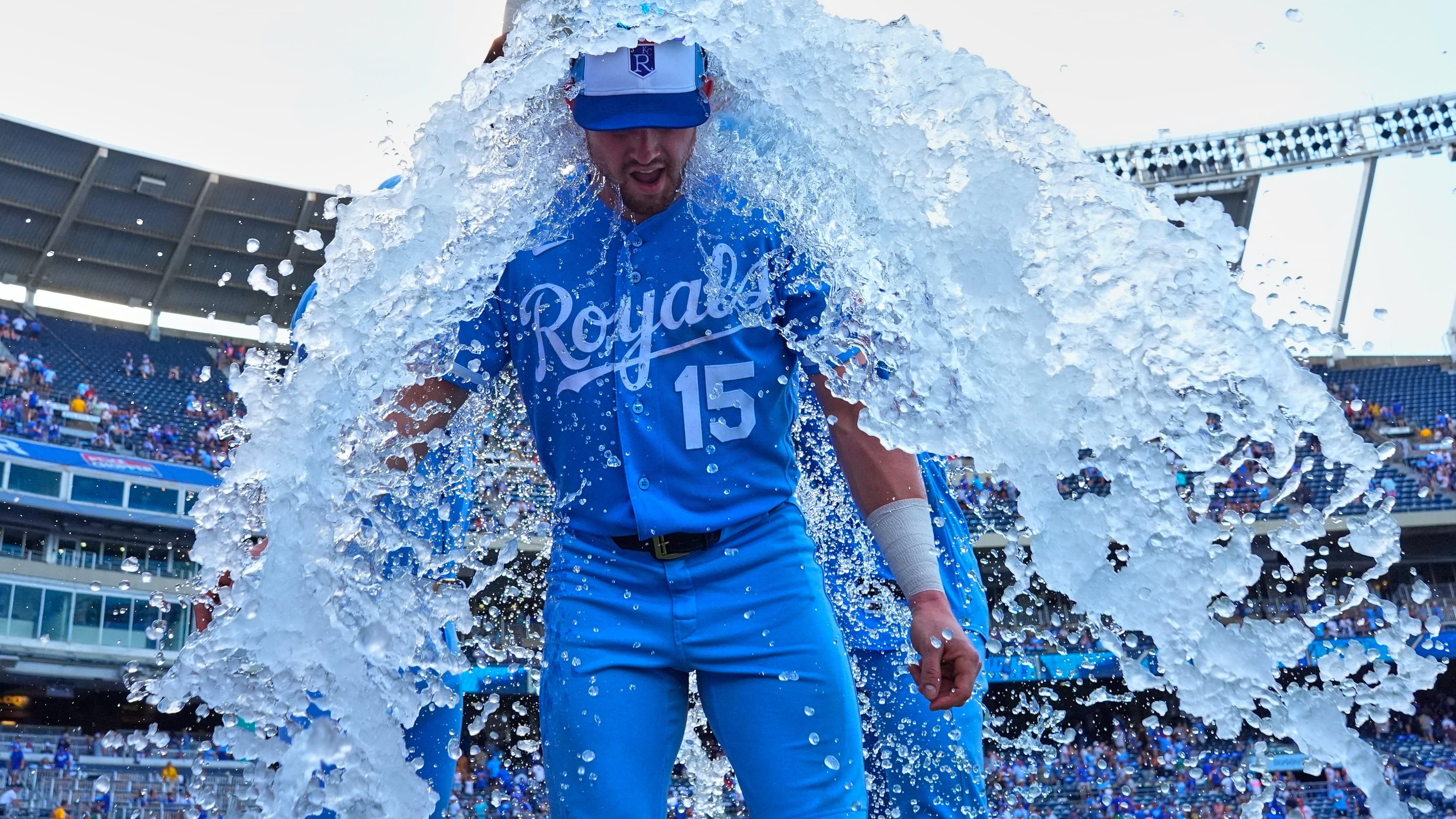 Kansas City Royals' Lane Thomas is doused by teammates after their baseball game against the San Diego Padres, Saturday, July 18, 2026, in Kansas City, Mo. (AP Photo/Charlie Riedel)
