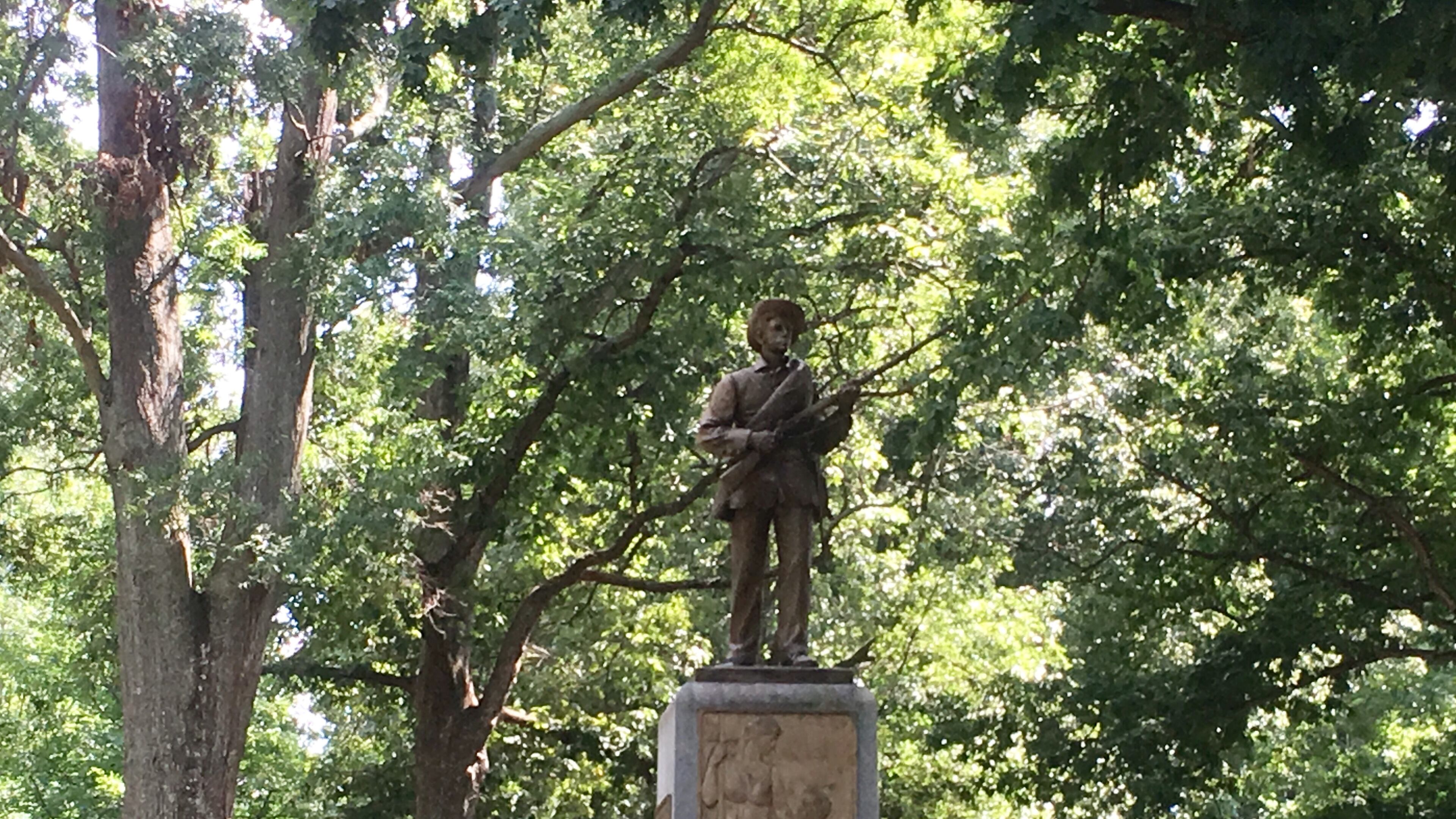 The "Silent Sam" statue on the University of North Carolina campus has been fortified with a double barrier of metal fencing amid protestors' demands it come down. Photo: Jennifer Brett