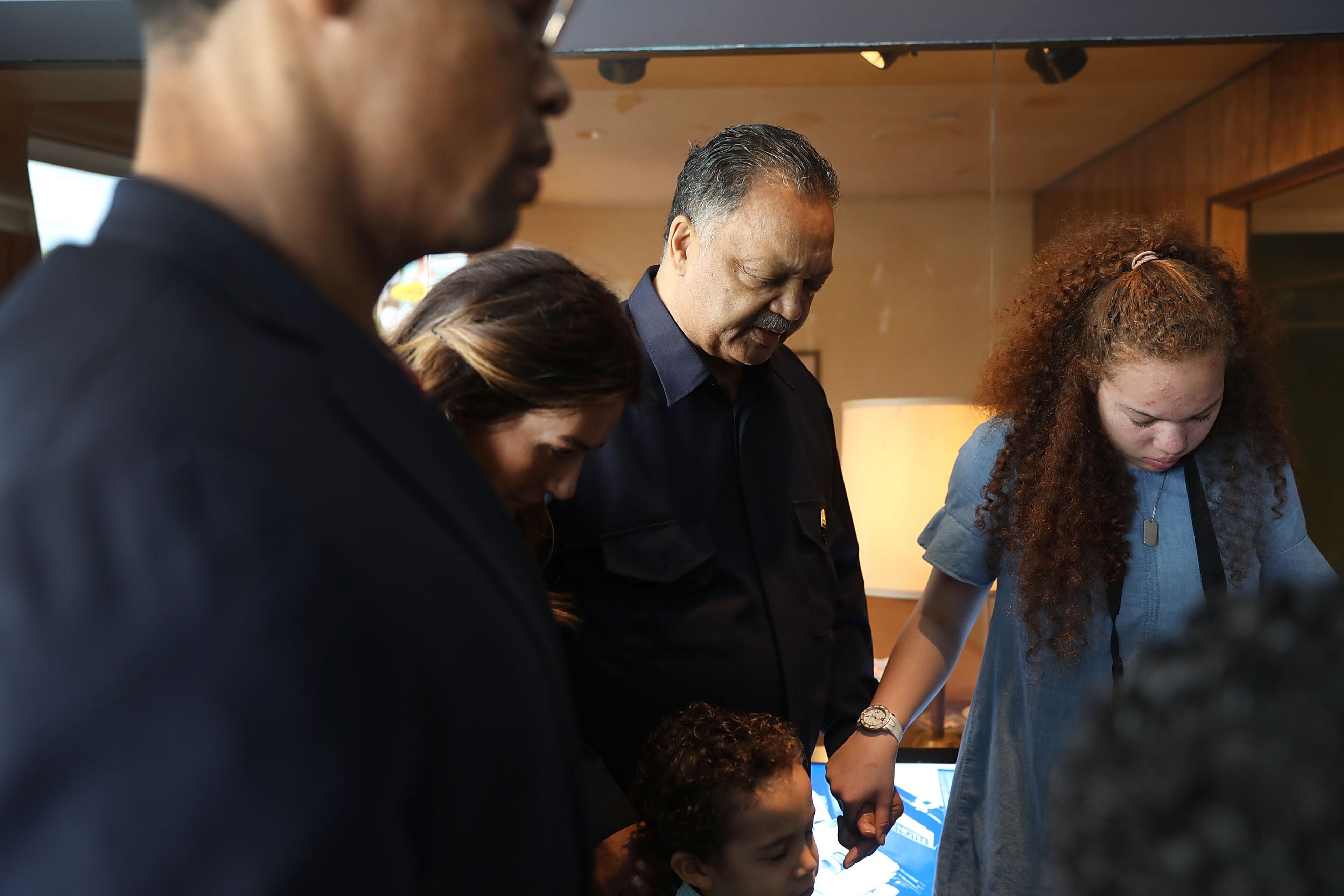 MEMPHIS, TN - APRIL 03: Rev. Jesse Jackson prays with his family outside room 306 at the Lorraine Motel, where he was when Dr. Martin Luther King, Jr. was assassinated, on April 3, 2018 in Memphis, Tennessee. The motel is now part of the complex of the National Civil Rights Museum, which is commemorating the 50th anniversary of King's assassination on April 4, 1968. (Photo by Joe Raedle/Getty Images)