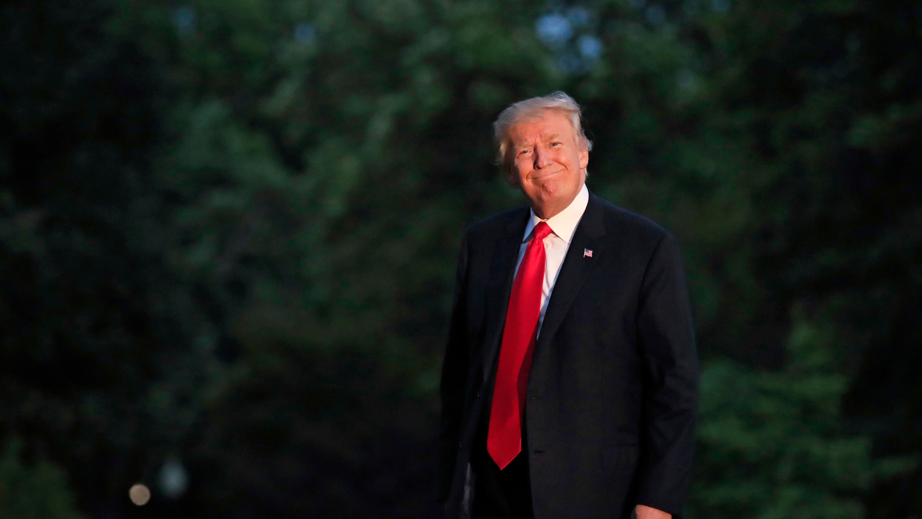 President Donald Trump smiles as he walks on the South Lawn upon arrival the White House in Washington, Saturday, July 8, 2017, from the G20 Summit in Hamburg, Germany. (AP Photo/Manuel Balce Ceneta)