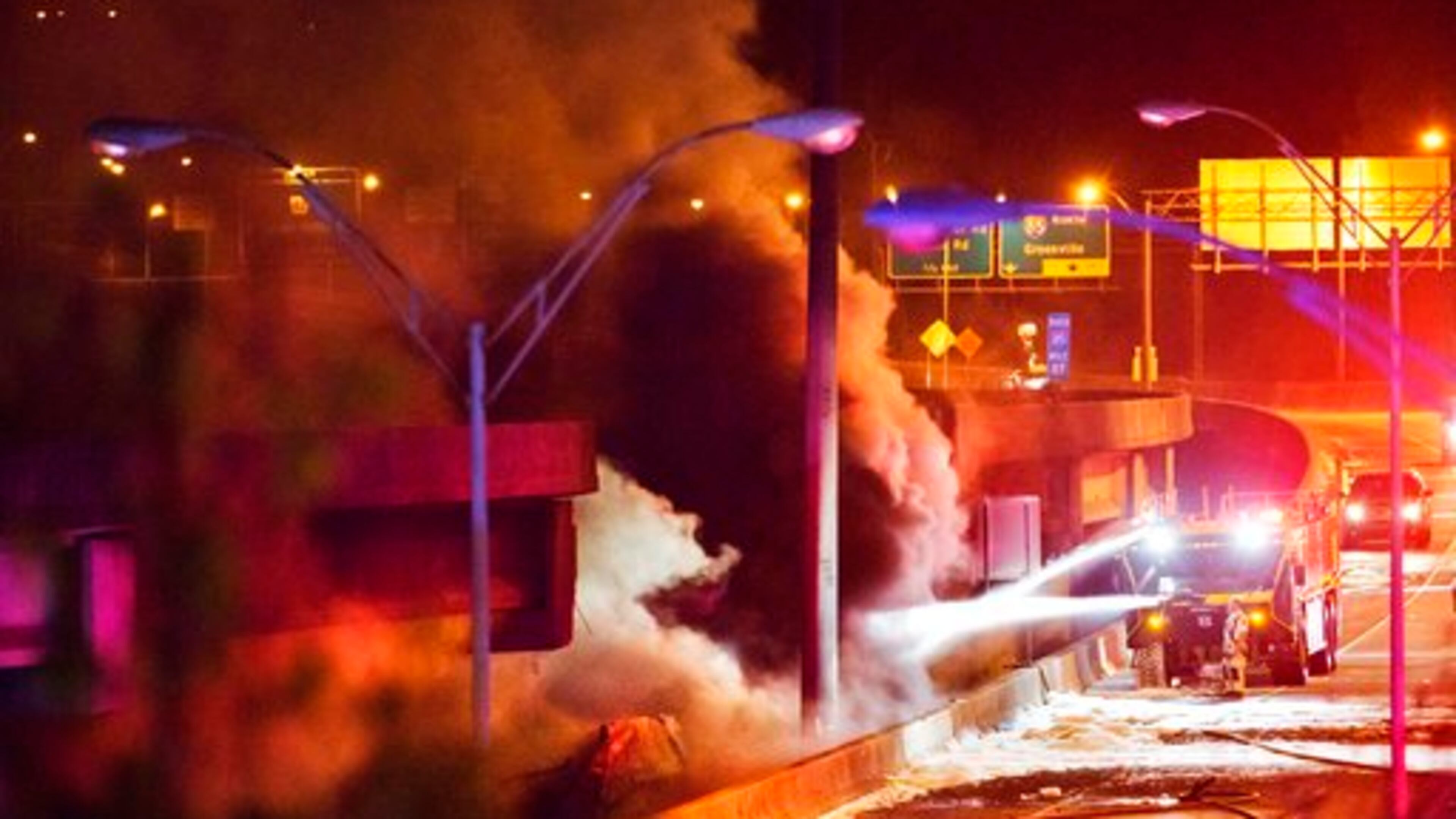 Smoke billows from a section of an overpass that collapsed from a large fire on Interstate 85 in Atlanta, Thursday, March 30, 2017. Witnesses say troopers were telling cars to turn around on the bridge because they were concerned about its integrity. Minutes later, the bridge collapsed. (AP Photo/David Goldman)