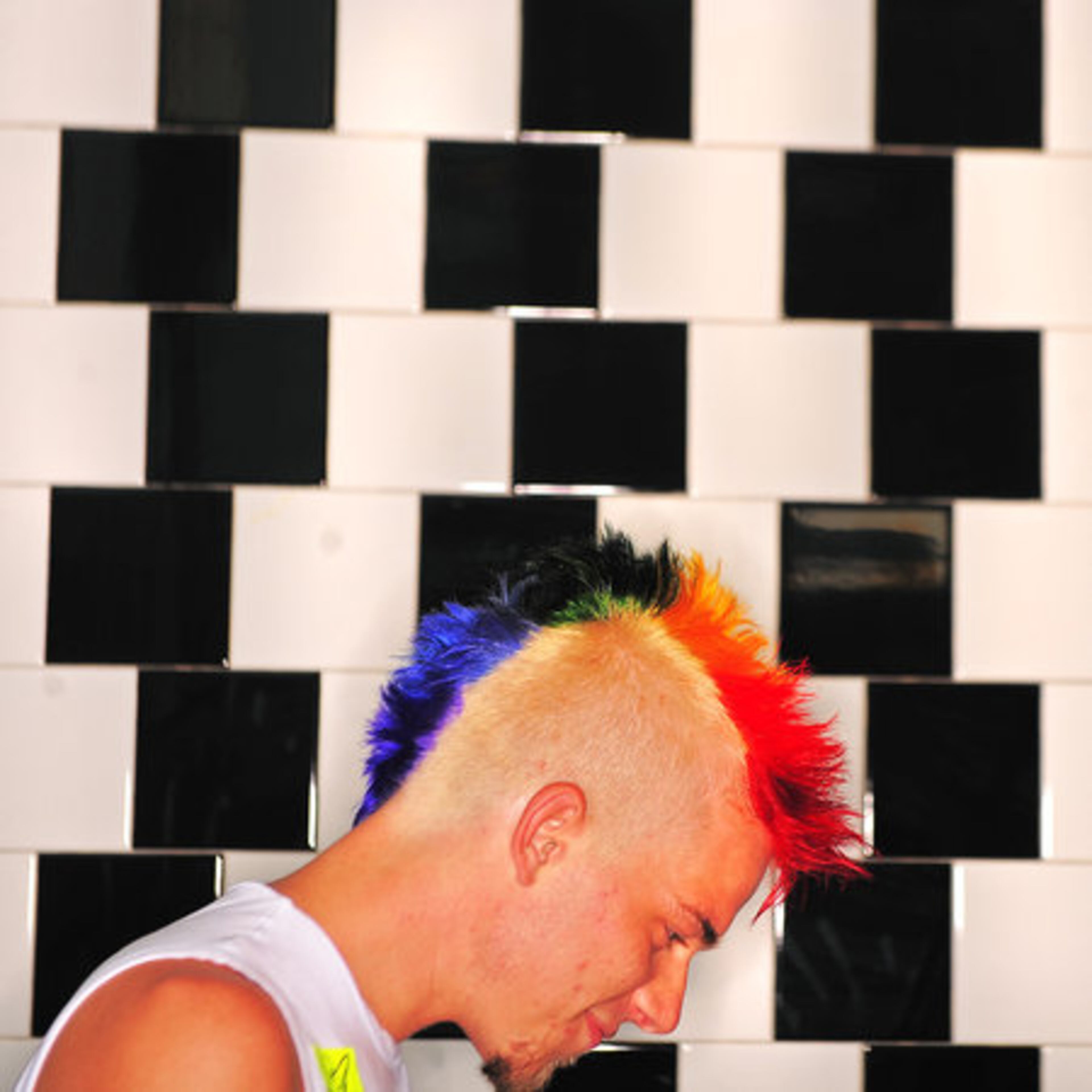 AJC photographer Pouya Dianat on Saturday took portraits of attendees at the Atlanta Pride Festival. Here, Brett Parker, 24, an Atlanta hairdresser, shows his new hair style at the Atlanta Civic Center. Parker has been attending the Pride festival since he was 15.
