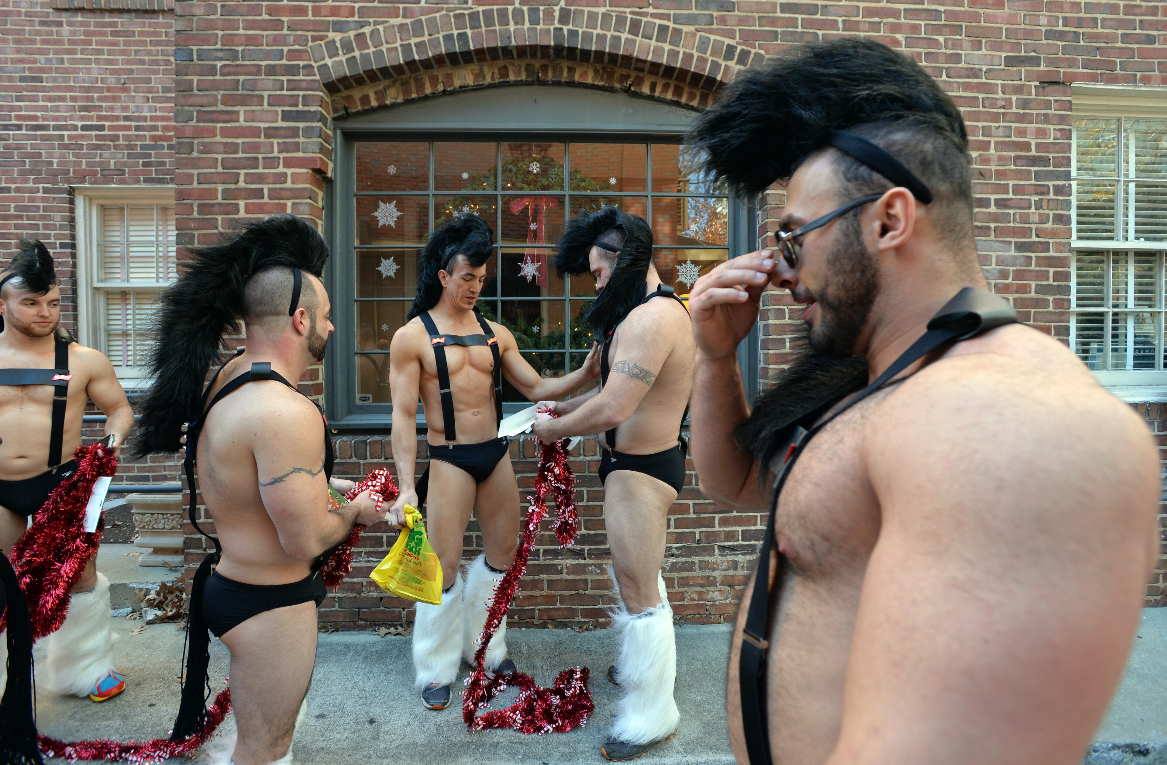 December 13, 2014 Atlanta - Participants prepare before Atlanta Santa Speedo Run at Hudson Grill Midtownon on Saturday, December 13, 2014. The race is run to raise money during the 2014 Santa Speedo Run. These 'lightly' dressed Santas are fundraising to support Everybody Wins! Atlanta, a nonprofit devoted to improving children's reading skills that below current grade level. HYOSUB SHIN / HSHIN@AJC.COM