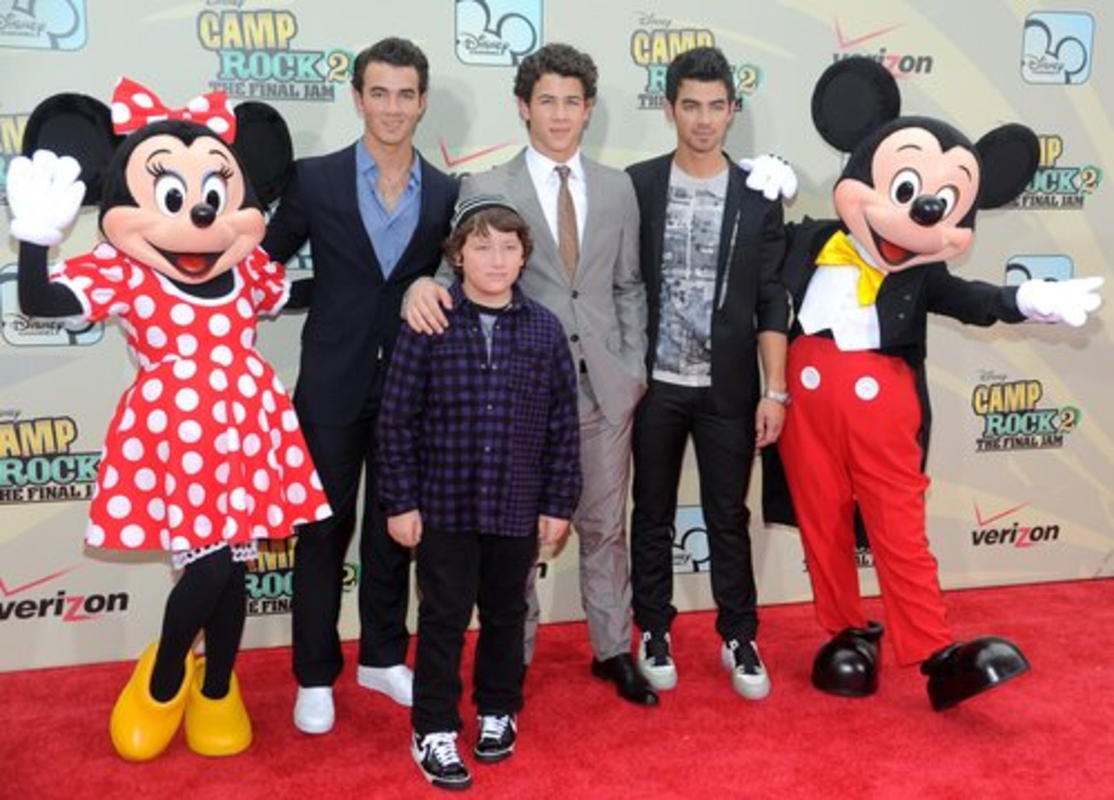 Cast members, from left, Kevin Jonas, Frankie Jonas, Nick Jonas and Joe Jonas pose with Minnie and Mickey Mouse at the premiere of 'Camp Rock 2: The Final Jam' at Alice Tully Hall on Wednesday, Aug. 18, 2010 in New York.