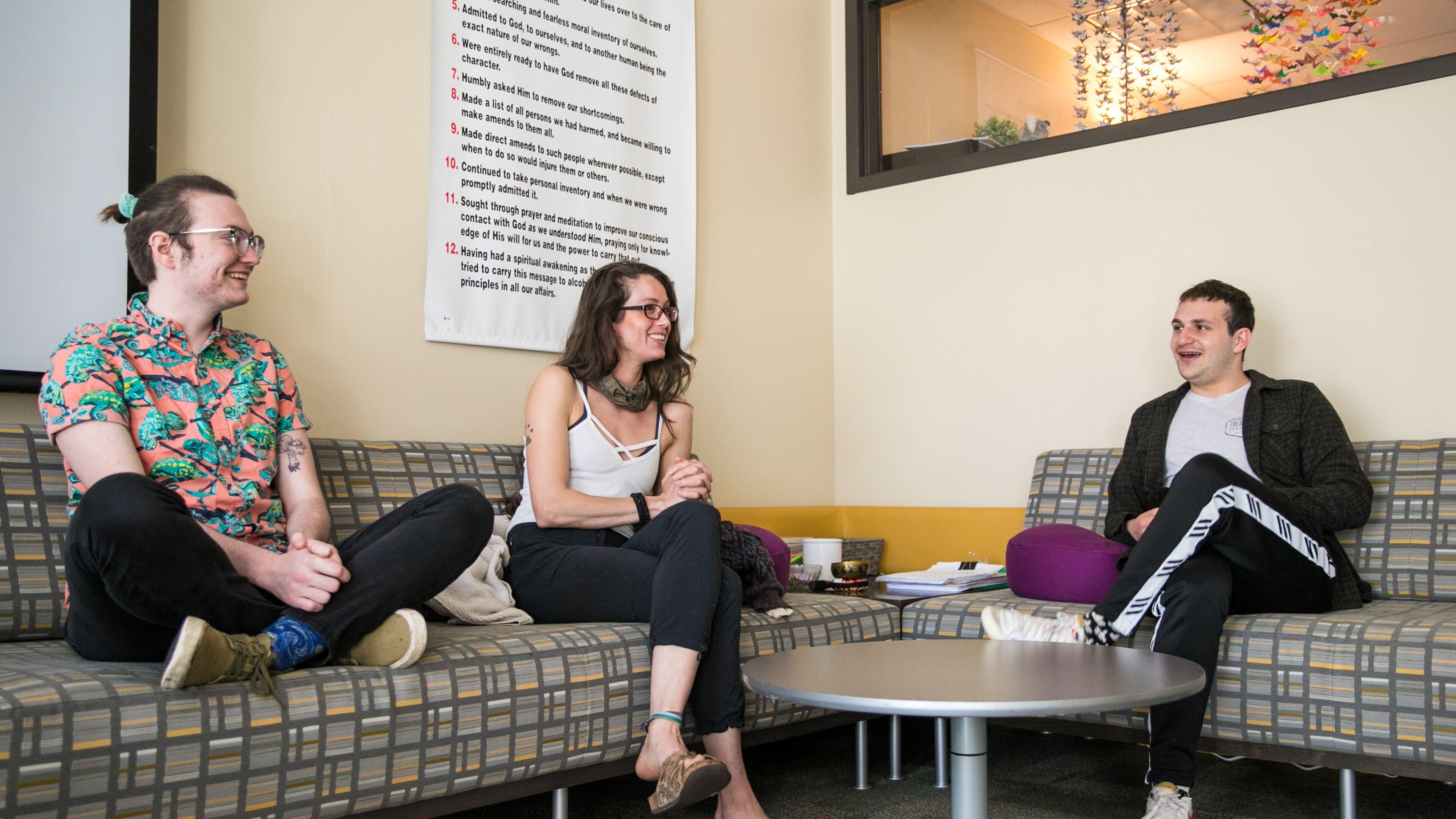 Kennesaw State University has many success stories from their Center for Young Adult Addiction and Recovery programs. A few students, including Frankie Berryman, from left, Kevyn Wakefield and Justin Schechter check in with each other and the center's director on March 3, 2022. The group is going on a sober Spring Break trip together as they connect and support each other in their Twelve Steps. (Jenni Girtman for The Atlanta Journal-Constitution)