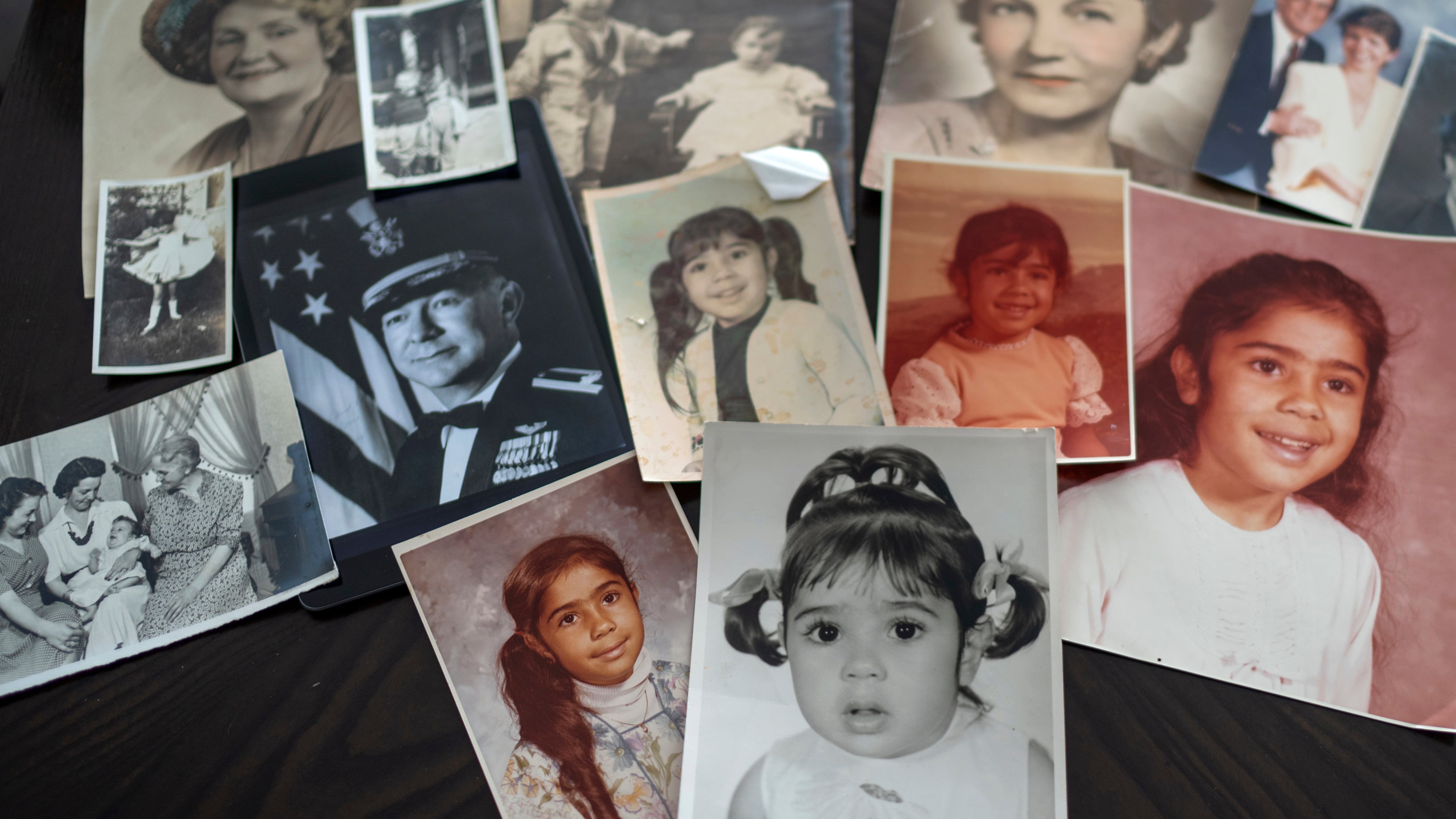 FILE - Childhood photos of a woman adopted as a toddler by an American war veteran, who he found in the 1970s in an Iranian orphanage and raised as a Christian, are displayed along with a picture of her father, a WWII Air Force veteran, at left, and additional family photos, Monday, June 24, 2024, in Henderson, Nev. (AP Photo/David Goldman, File)