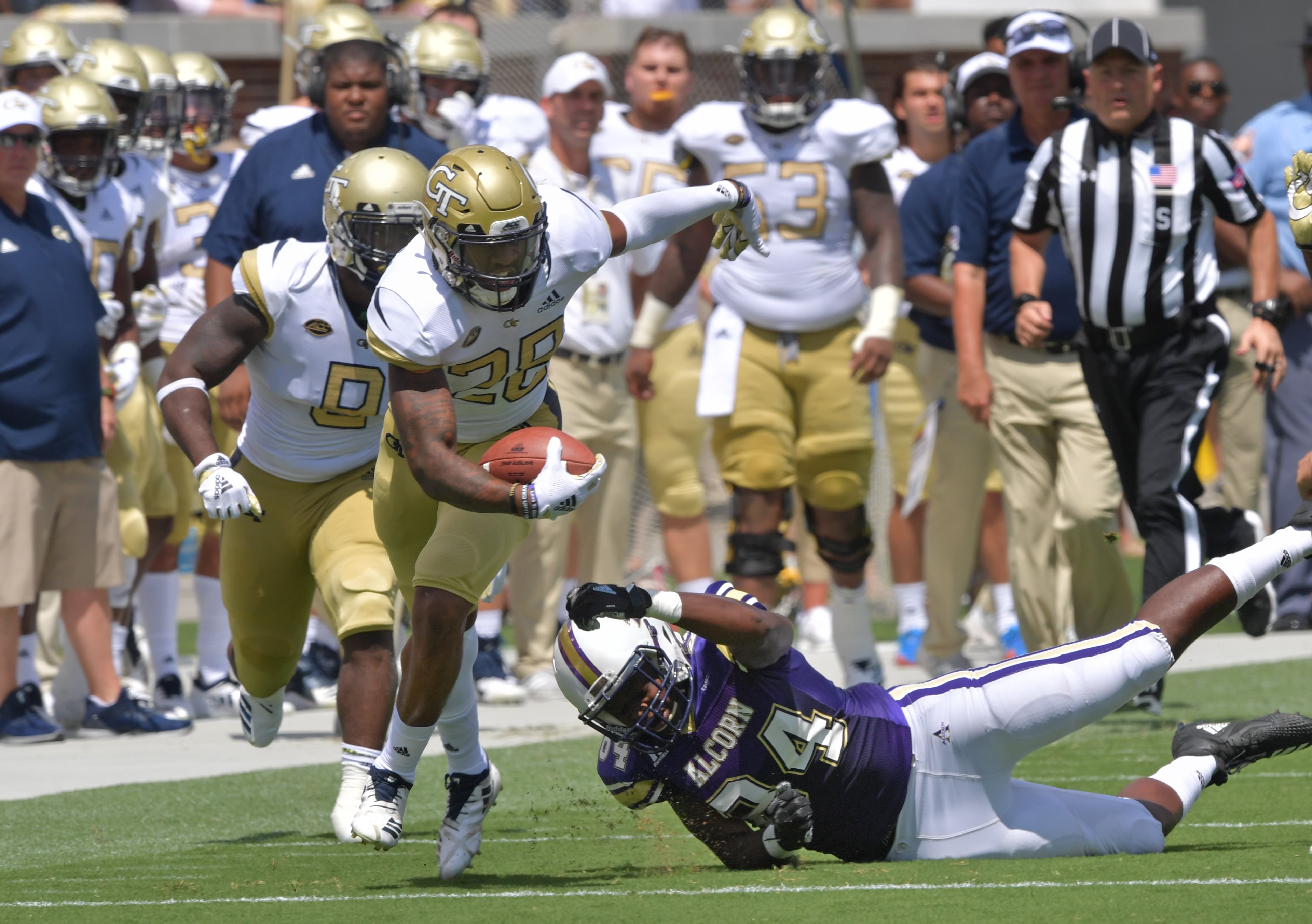 September 1, 2018 Atlanta - Georgia Tech defensive back Juanyeh Thomas (28) eludes a tackle by Alcorn State tight end Jerimiah Green (84) in the first half of the Georgia Tech home opener at Bobby Dodd Stadium on Saturday, September 1, 2018. HYOSUB SHIN / HSHIN@AJC.COM