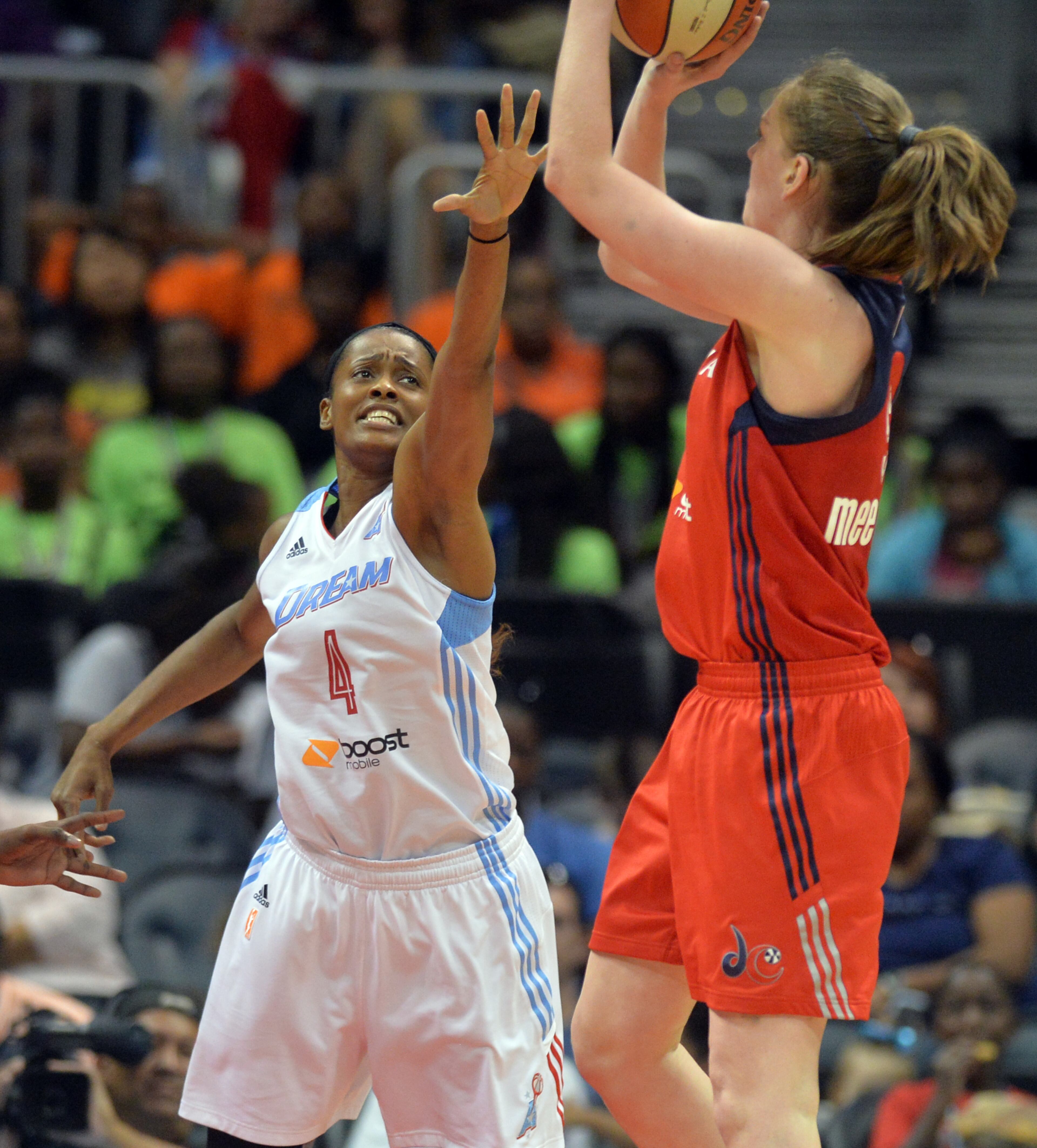 Washington Mystics' Emma Meesseman shoots over the Atlanta Dream's Swin Cash Wednesday June 18, 2014 at Philips Arena. BRANT SANDERLIN /BSANDERLIN@AJC.COM