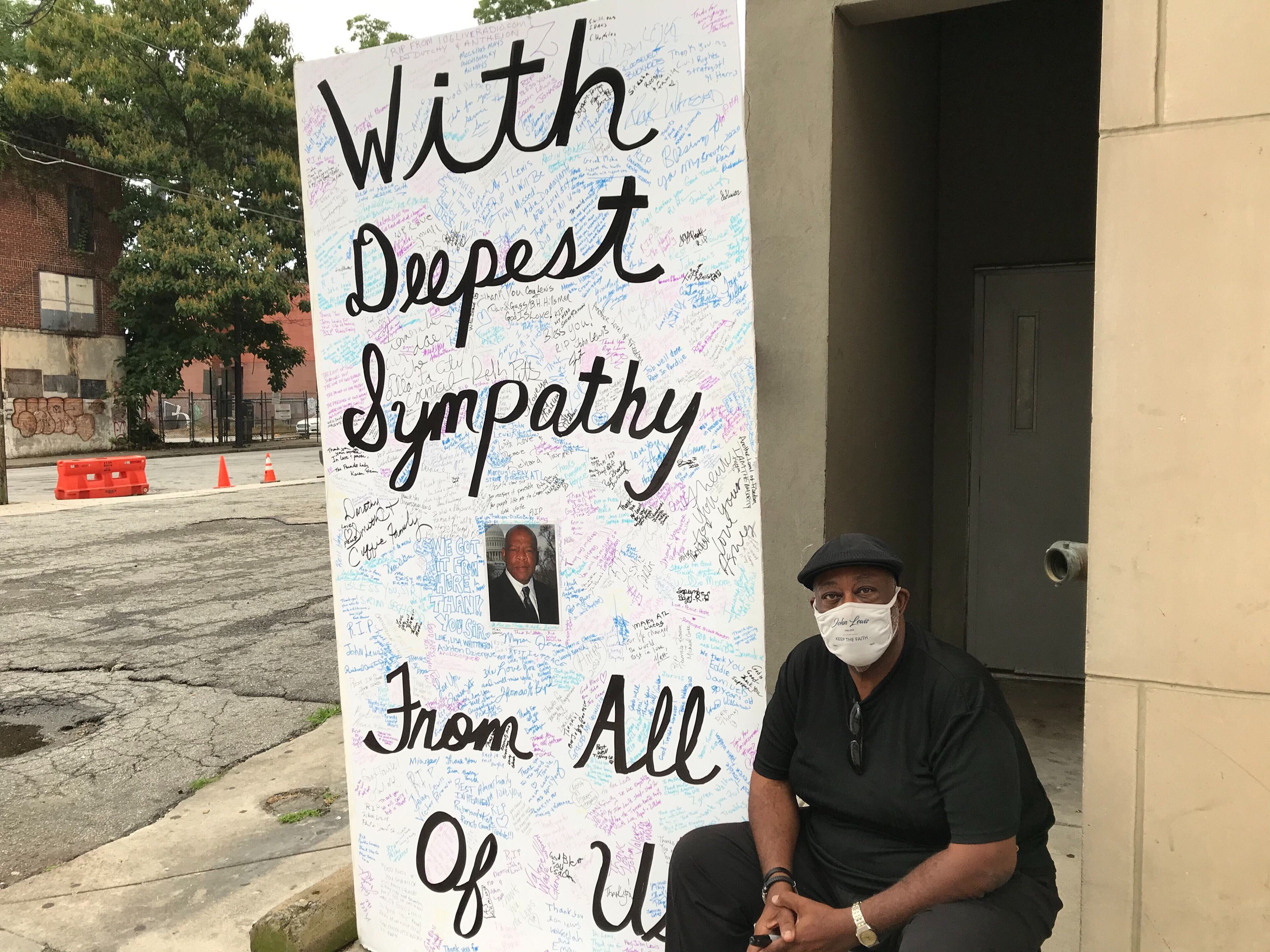 Bruce W. Griggs, founder of Operation Correct Start of America’s, arrived at the John Lewis mural in Atlanta Thursday morning with a giant sympathy card for others to sign. He has taken the card to Troy, Washington, DC and now Atlanta. (Shelia Poole / AJC)