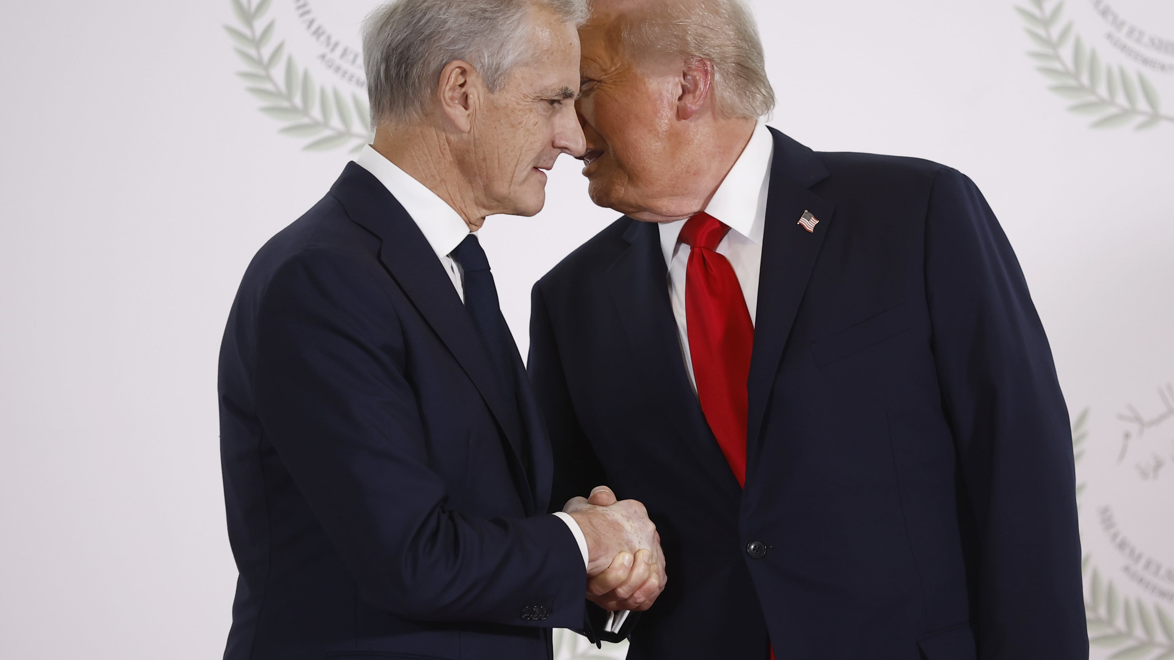 FILE - President Donald Trump and Norway's Prime Minister Jonas Gahr Store shake hands during the group photo at the Gaza International Peace Summit in Sharm el-Sheikh, Egypt, Oct.13 2025. (Yoan Valat, Pool photo via AP, File)