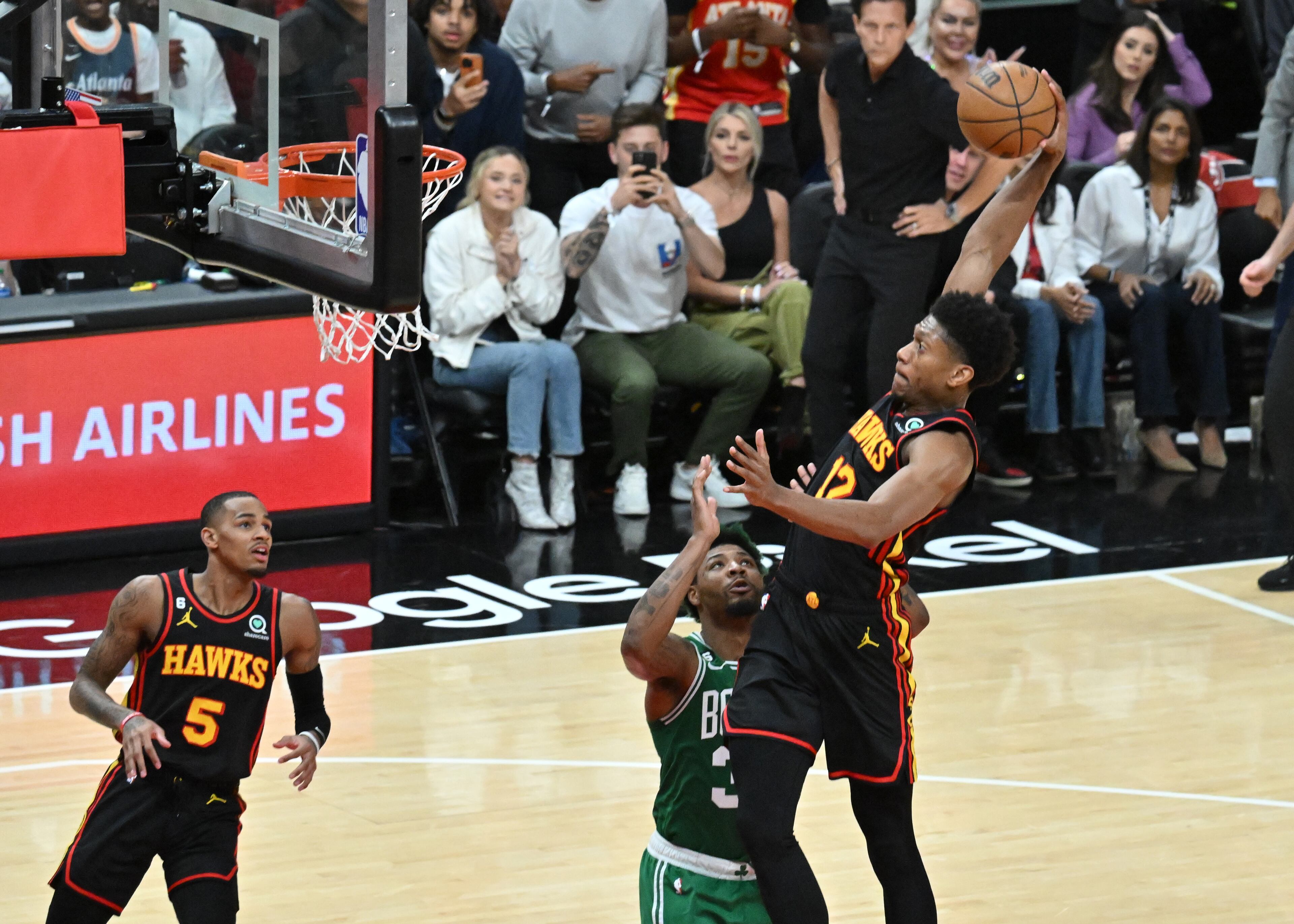 Hawks forward De'Andre Hunter dunks against the Celtics during the first half in Game 4 of the first round of the Eastern Conference playoffs at State Farm Arena, Sunday, April 23, 2023, in Atlanta. (Hyosub Shin / Hyosub.Shin@ajc.com)