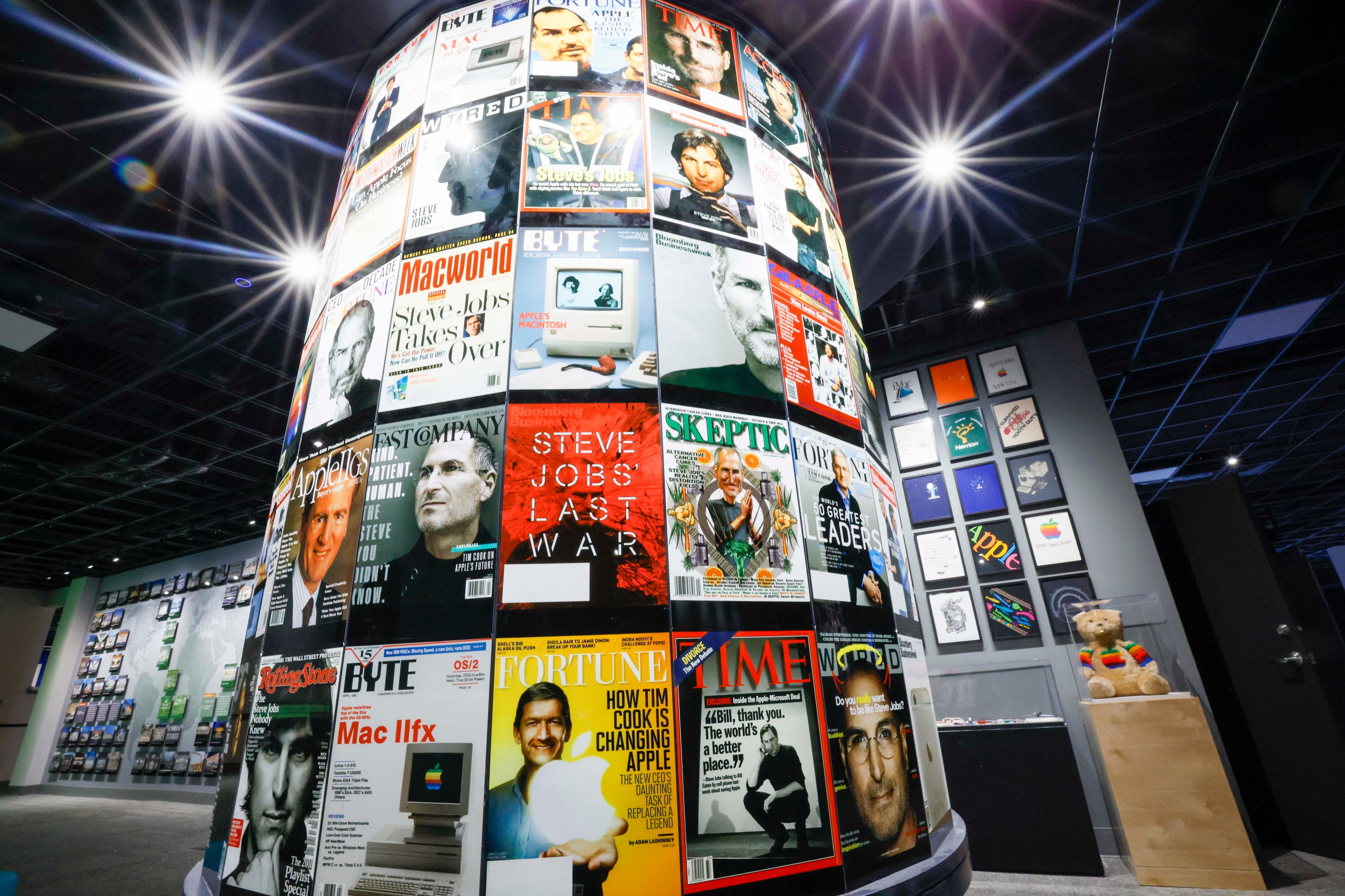 A collection of magazine covers featuring Apple products or personnel is part of the "50 Years of Innovation from Apple" exhibit. (Miguel Martinez/AJC)
