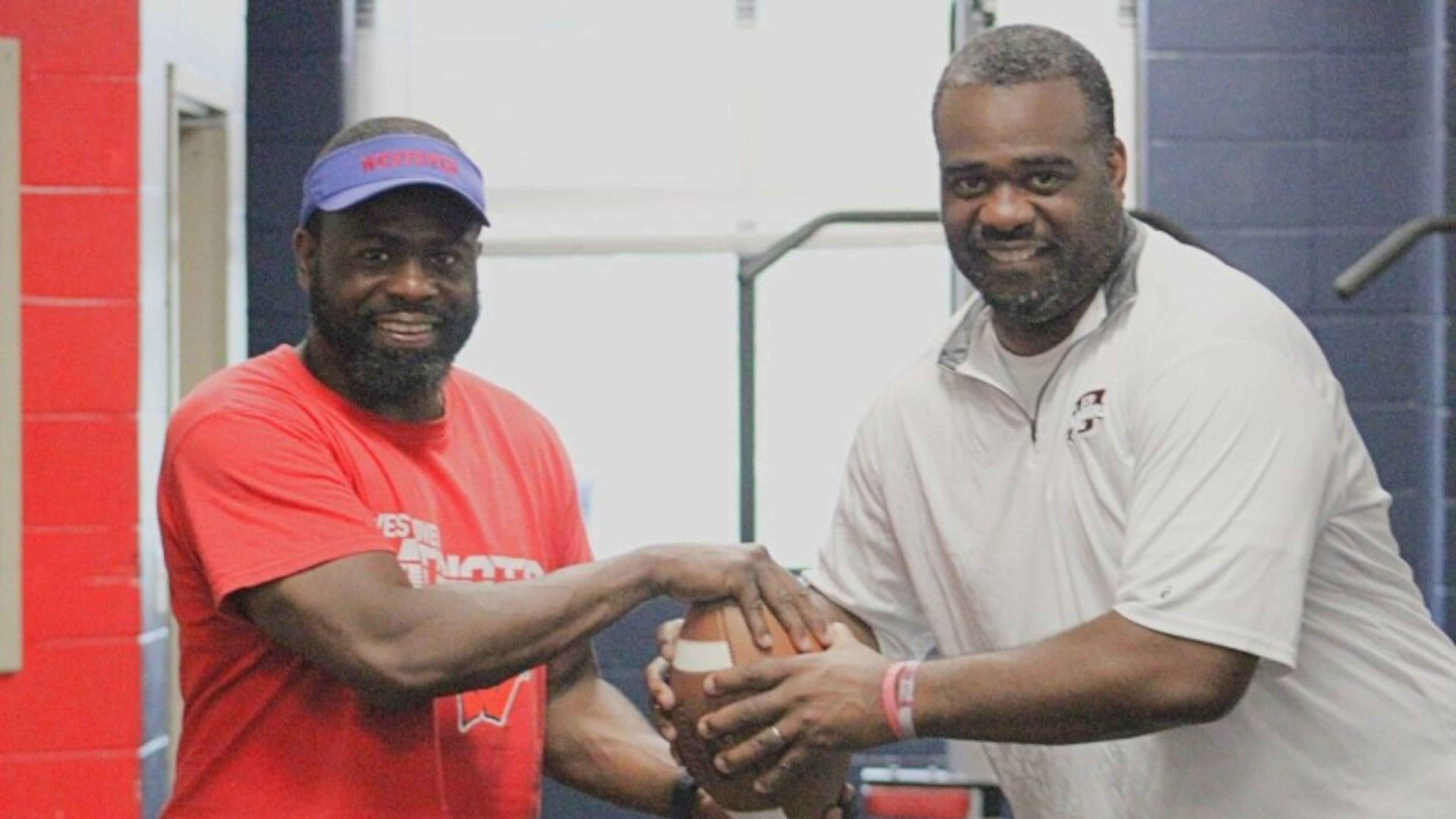 Two brothers — Westover coach Corey Joyner, (left) and Dougherty coach Uyl Joyner — will be on opposite sidelines when their teams face off Friday for a region championship. (Courtesy of Joe Whitfield/Albany Herald)