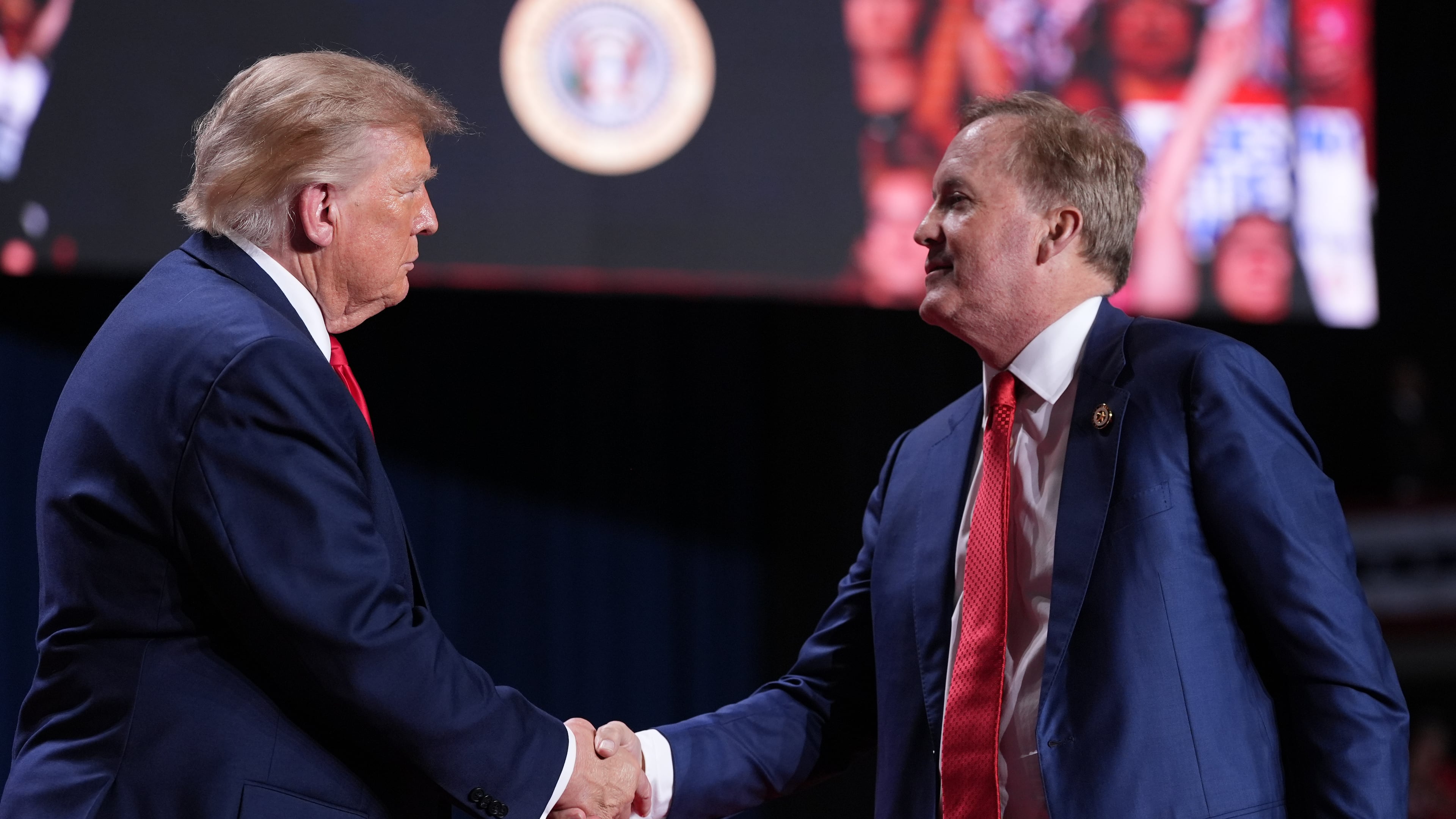 President Donald Trump greets Republican U.S. Senate candidate Texas Attorney General Ken Paxton at a campaign rally at the Freeman Coliseum in San Antonio, Wednesday, Oct. 7, 2026. (AP Photo/Alex Brandon)