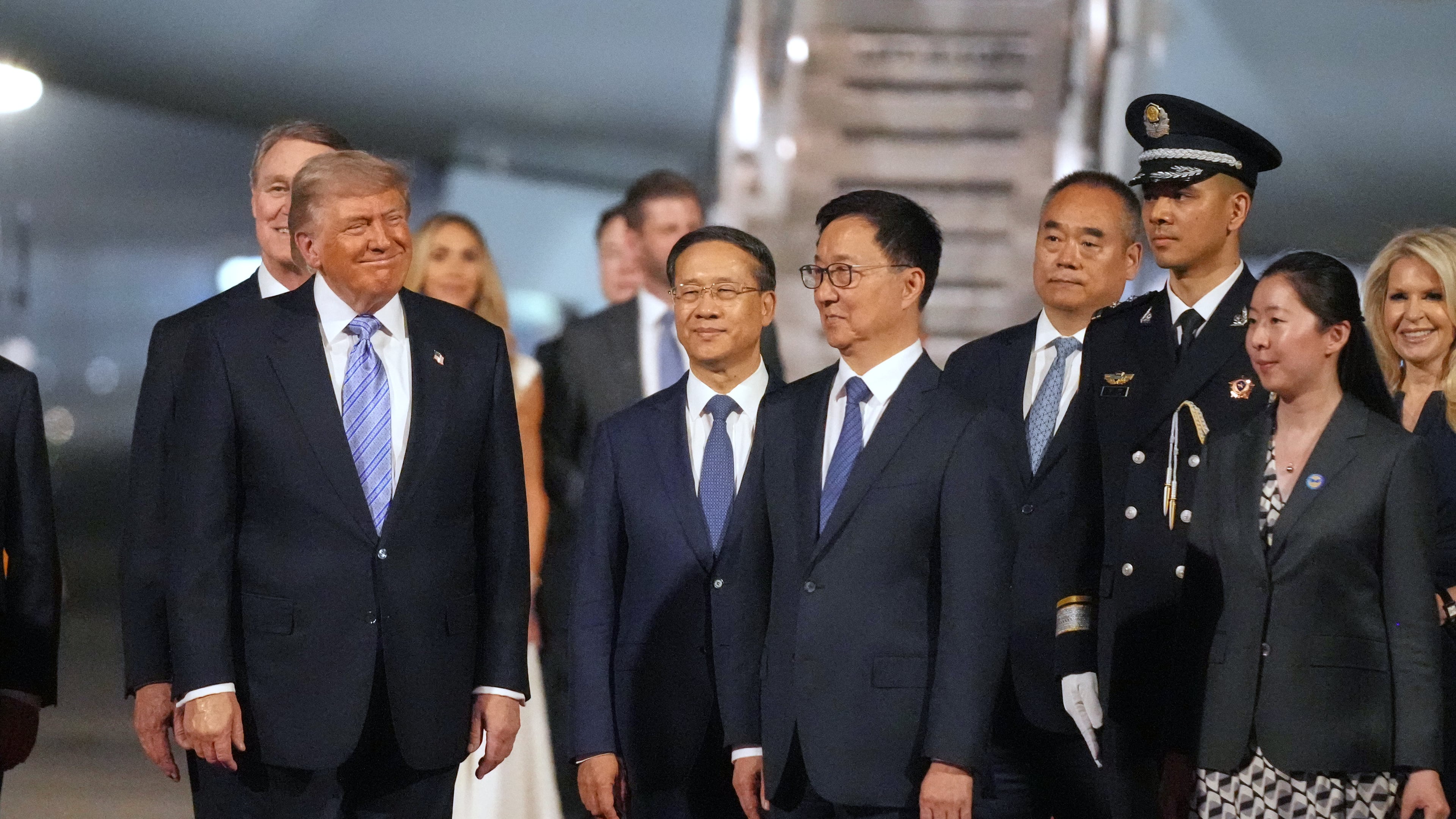 President Donald Trump pauses with China's Vice President Han Zheng during an arrival ceremony Wednesday, May 13, 2026, at Beijing Capital International Airport in Beijing. (AP Photo/Mark Schiefelbein)