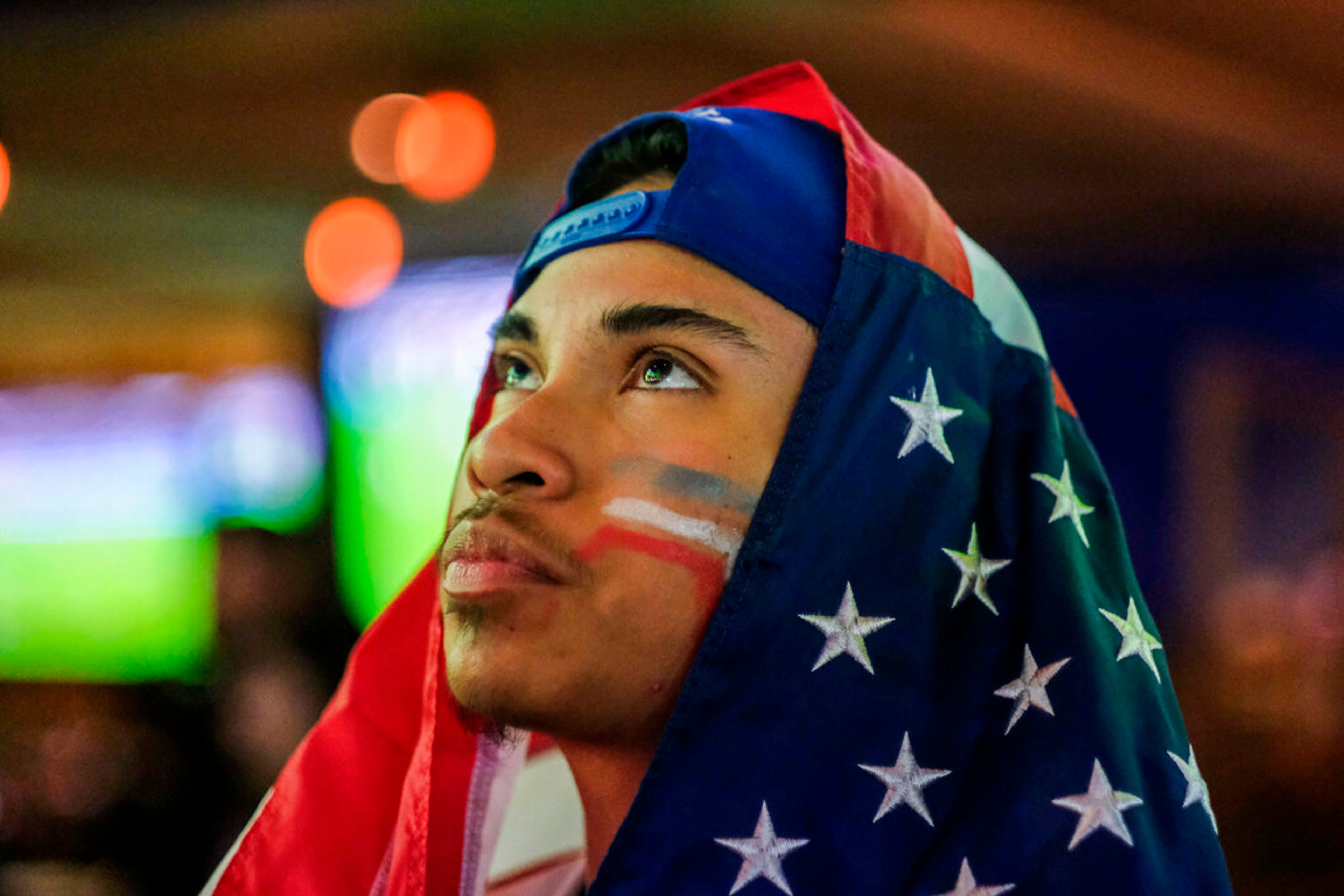 Josue Velasquez watches during a watch party for the World Cup group B soccer match between Iran and the United States in Los Angeles, Tuesday, Nov. 29, 2022. (AP Photo/Ringo H.W. Chiu)