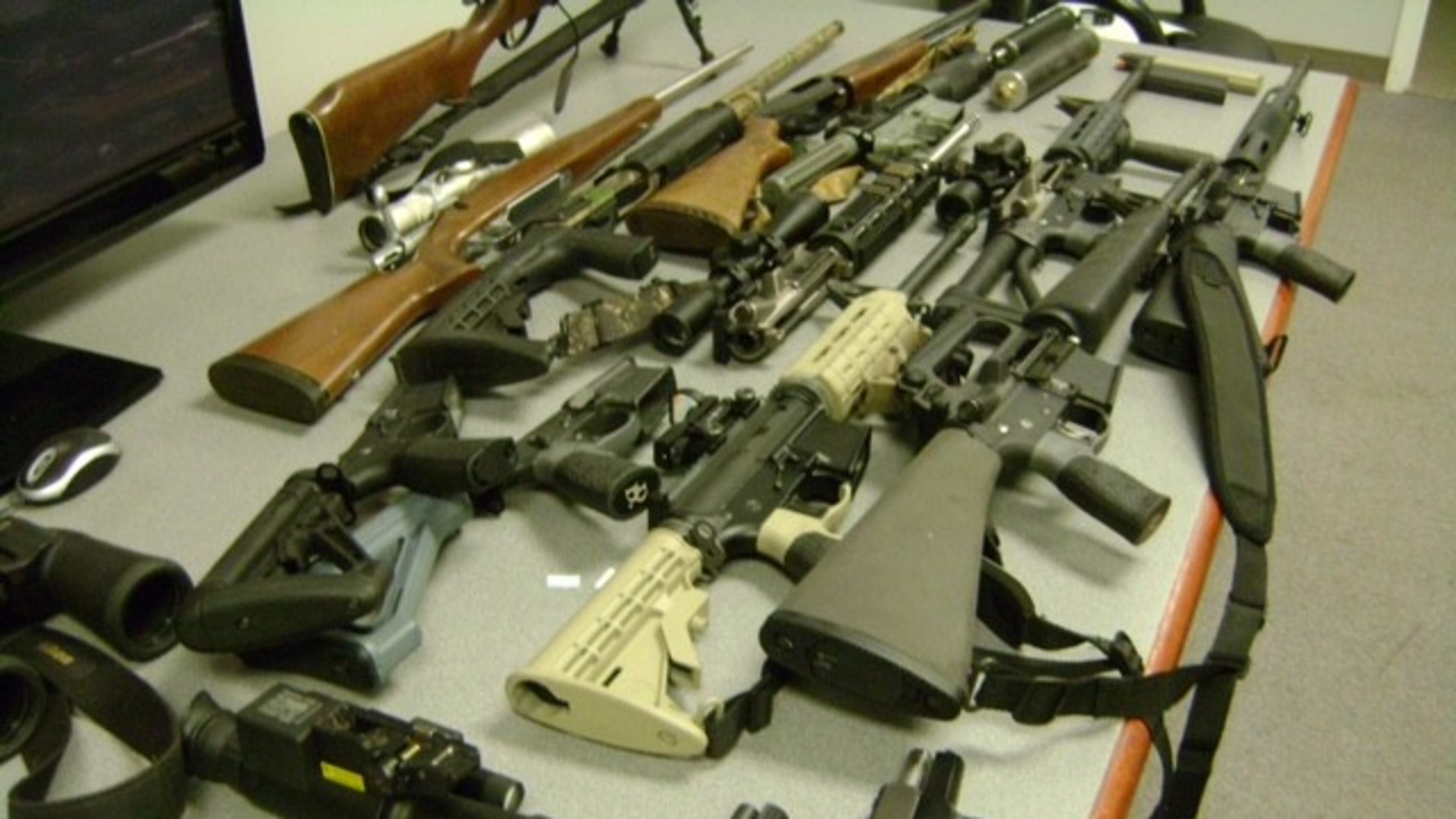 Weapons seized during a raid on a home in South Forsyth earlier this week . Sherif’s deputies also netted a reporte