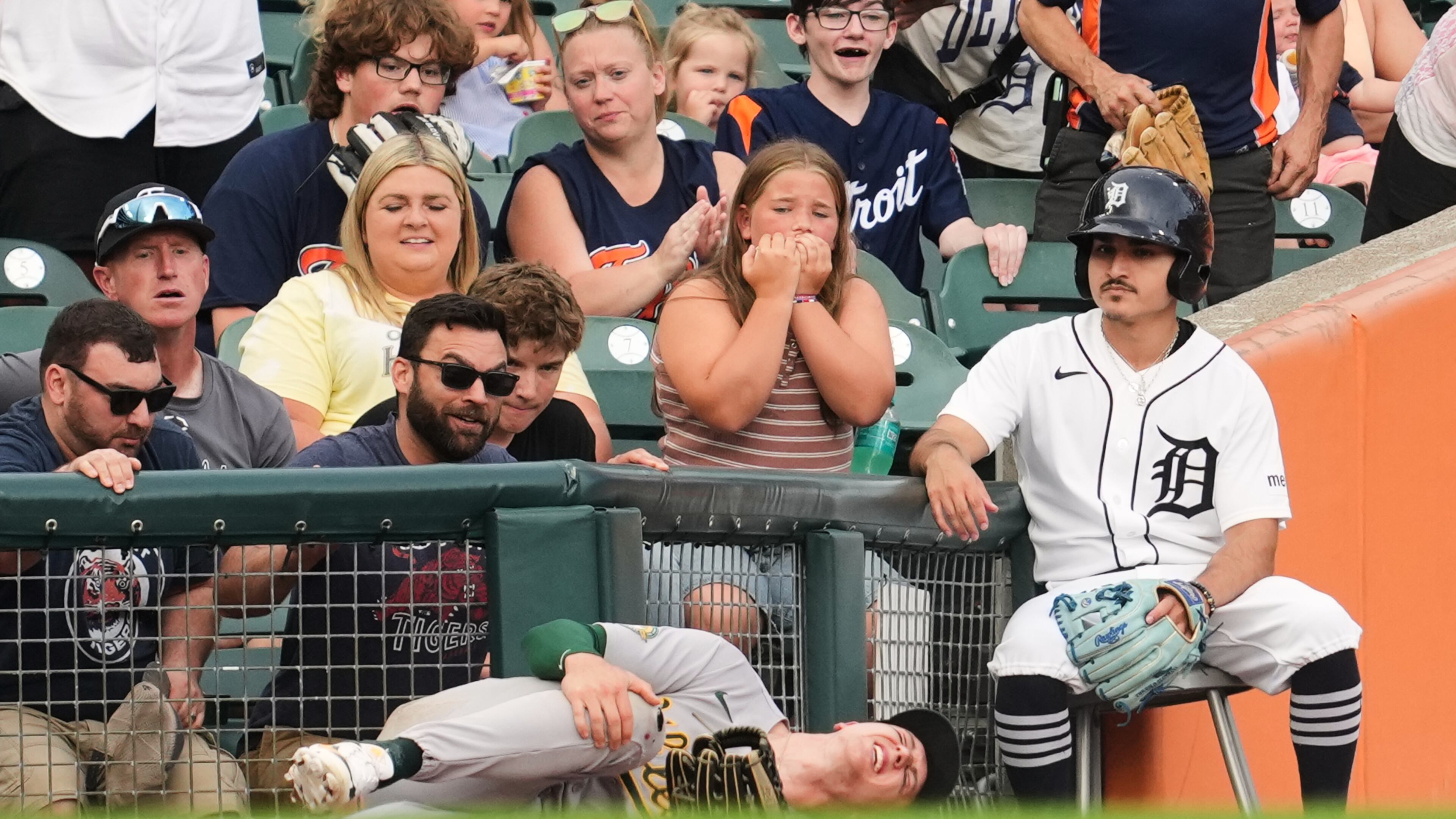 FILE - Athletics left fielder Zack Gelof grabs his leg after contacting the fence while catching a Detroit Tigers' Zach McKinstry fly ball in foul territory during the third inning of a baseball game Thursday, July 9, 2026, in Detroit. (AP Photo/Paul Sancya, File)