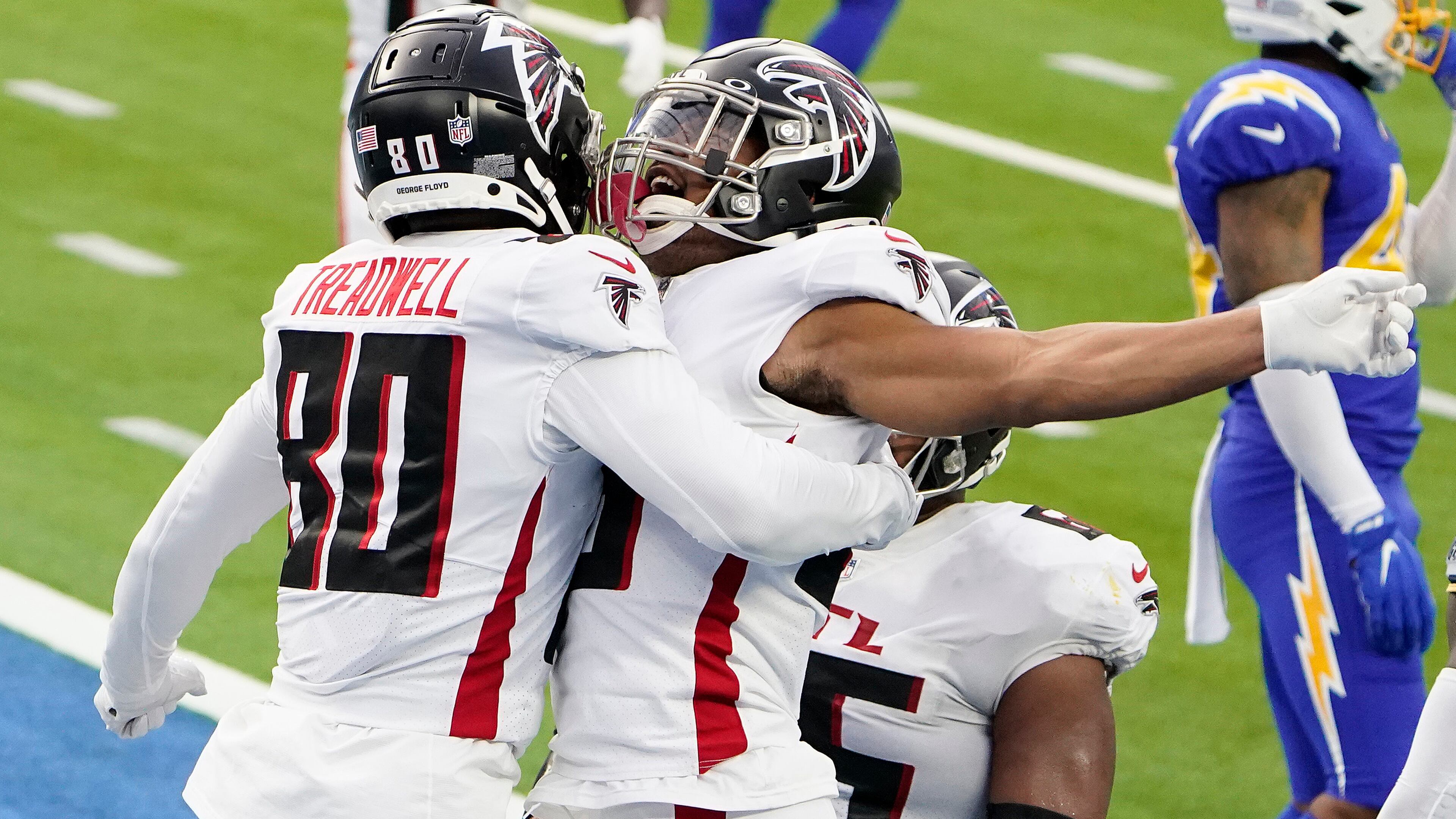 Atlanta Falcons wide receiver Laquon Treadwell (left) celebrates his touchdown catch against the Los Angeles Chargers with running back Ito Smith Sunday, Dec. 13, 2020, in Inglewood, Calif. (Jae C. Hong/AP)