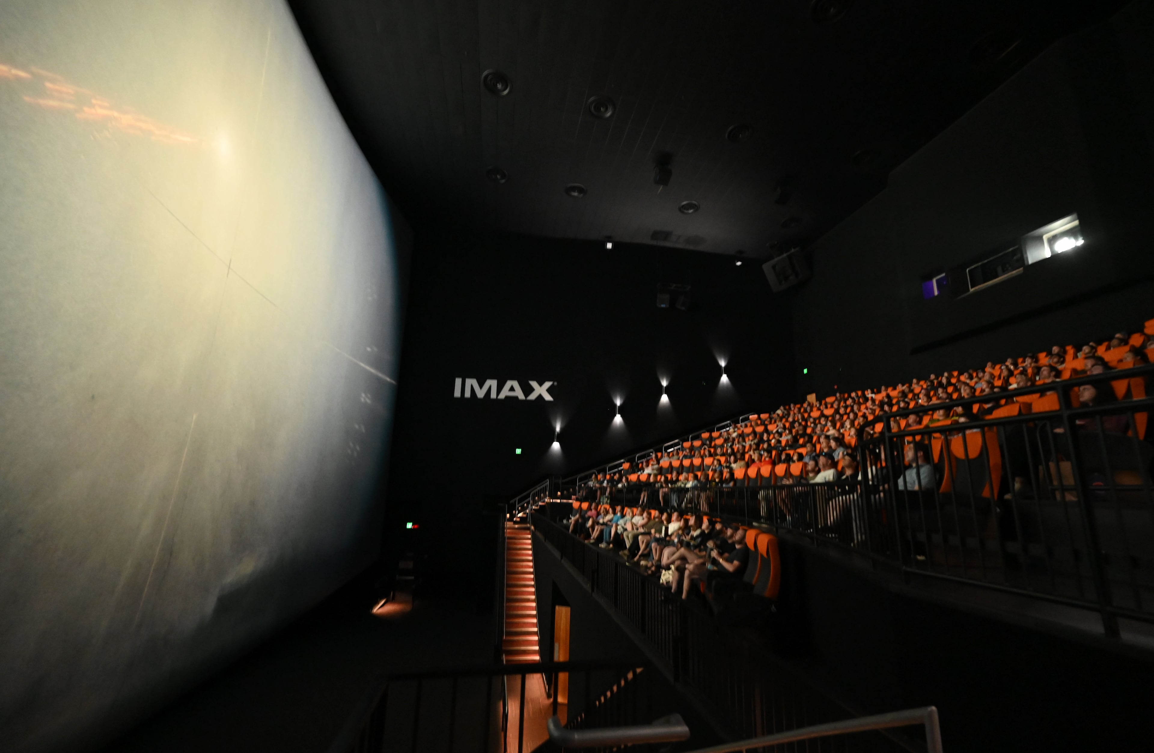Moviegoers take their seats before a screening of “The Odyssey.” Regal Cinemas at the Mall of Georgia is the only 70mm IMAX theater in the state. (Hyosub Shin/AJC)