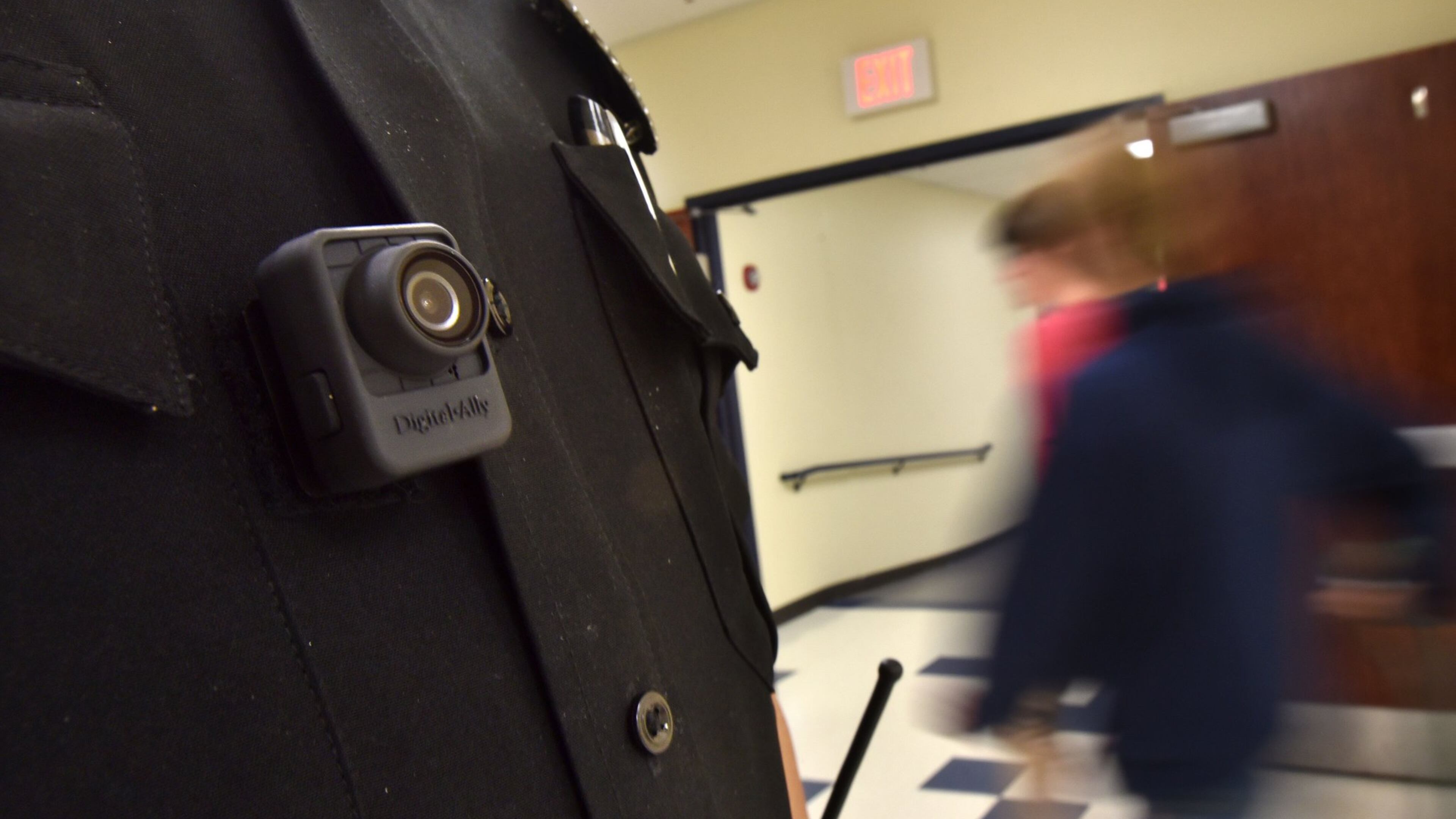 Officer Tate Ledford of the Cobb County School District Police Department, wearing a body camera, conducts a routine check at Wheeler High School in Marietta. Clayton, Cobb and Gwinnett Counties are among the school districts whose officers wear the cameras. Officers in Atlanta, DeKalb and Fulton do not. DeKalb is looking into buying cameras for its officers, a spokesman says. HYOSUB SHIN / HSHIN@AJC.COM
