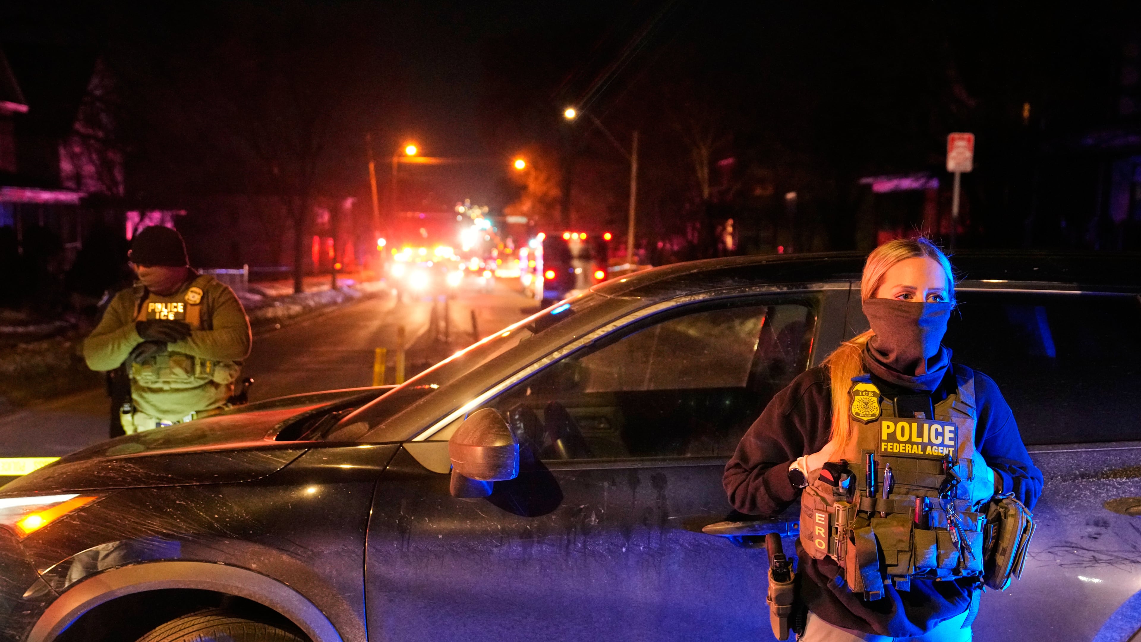 FILE - Federal immigration officers at the scene of a reported shooting Wednesday, Jan. 14, 2026, in Minneapolis. (AP Photo/John Locher, File)